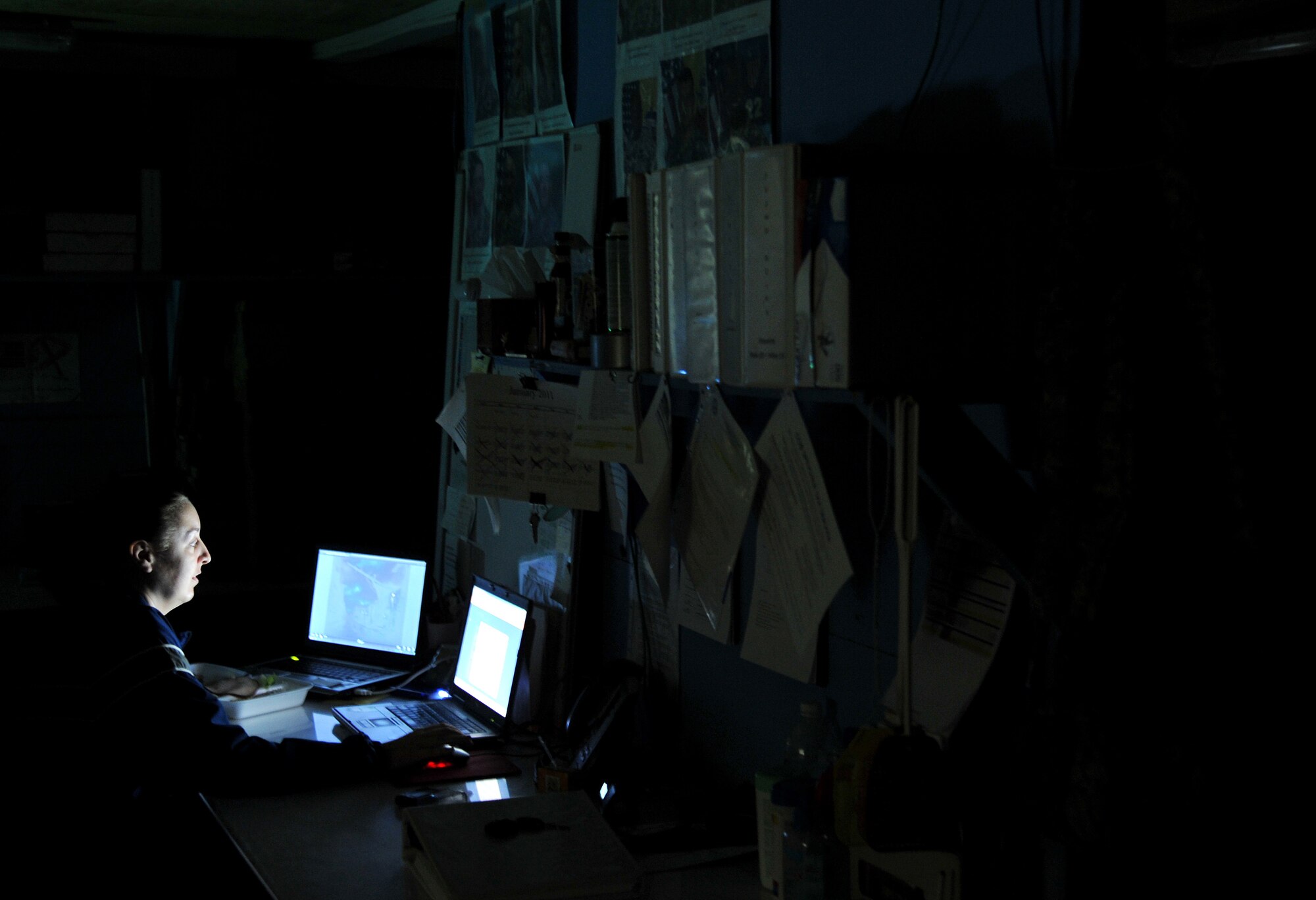 Staff Sgt. Janae Steude, 467th Casualty Liaison Team member, works in the office by herself on night shift Jan. 27, 2011, on Contingency Operating Base Speicher, Iraq. (U.S. Air Force photo by Senior Airman Andrew Lee/Released)