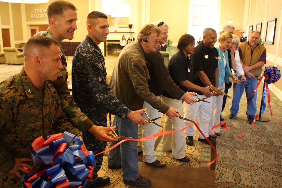 Col. Daniel Lecce (far left), commanding officer of Marine Corps base Camp Lejeune, cuts the ribbon marking the re-opening of Marston Pavilion aboard the base alongside the rest of the official party, Feb. 3. Following two years and more than $3 million, the pavilion was all but torn down and rebuilt, completely renovating and refurbishing the event center.