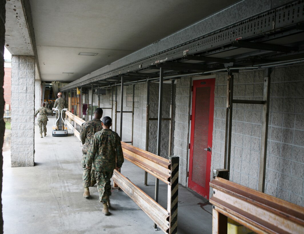 A conveyer belt system hangs from the ceiling inside one of the warehouses belonging to the Supply Management Unit, 2nd Supply Battalion, 2nd Marine Logistics Group, aboard Camp Lejeune, N.C., Feb. 2, 2011. Though the system fell out of use nearly a decade ago, the tempo of today’s society of supply and demand prompted the unit’s leadership to have the conveyer restored. (U.S. Marine Corps photo by Pfc. Franklin E. Mercado)