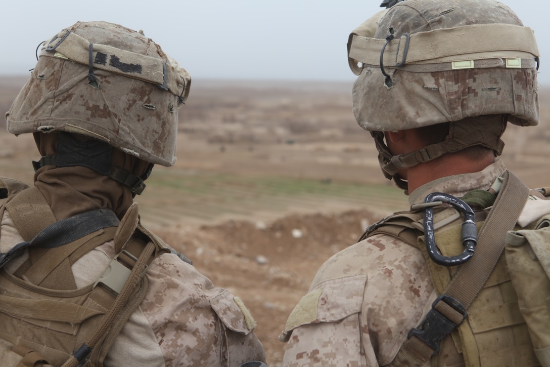 U.S. Marine Corps Lance Cpl. Jovani Gonzalez (left), an infantryman, receives last minutes instructions from his squad leader U.S. Marine Corps Cpl. Mitchel R. Atkins, both with 1st Platoon, Company L, Battalion Landing Team 3/8, 26th Marine Expeditionary Unit, Regimental Combat Team 2, prior to departing on a patrol near Combat Outpost Ouellette in the Helmand province, Afghanistan, Feb. 2, 2011. Elements of the 26th Marine Expeditionary Unit deployed to Afghanistan to provide regional security in Helmand province in support of the International Security Assistance Force.