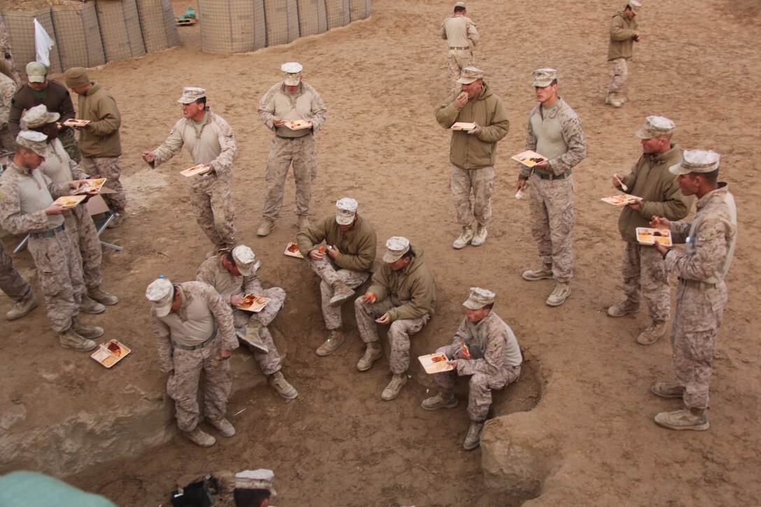 U.S. Marines with 1st Platoon, Company I, Battalion Landing Team 3/8, 26th Marine Expeditionary Unit, Regimental Combat Team 2, eat evening chow at a patrol base near Combat Outpost Ouellette in Helmand province, Afghanistan, Feb. 2, 2011. Elements of 26th Marine Expeditionary Unit deployed to Afghanistan to provide regional security in Helmand province in support of the International Security Assistance Force.