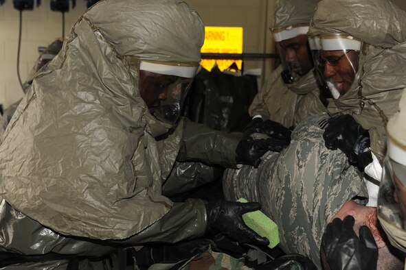 KUNSAN AIR BASE, Republic of Korea -- Medical technicians from the 8th Medical Group decontaminate a patient during a local exercise. Knowing how to decontaminate yourself, others and equipment is key to surviving a chemical attack. (U.S. Air Force photo/Senior Airman Ciara Wymbs)