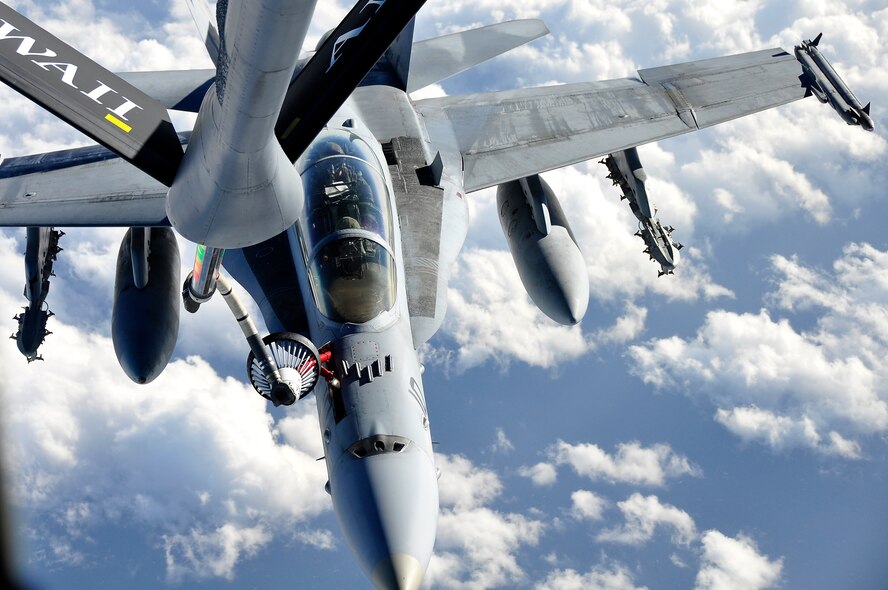 One of six Marine Corps F/A-18 Prowlers from Iwakuni Air Base, Japan, takes on fuel from a 96th Air Refueling Squadron KC-135 during a recent mission over the Pacific near Okinawa. This was the first off-station operational mission for the 96th ARS since it re-activated as a Total Force Integration active partner with the Hawaii Air National Guard?s 203rd ARS, July 23, 2010. The air refueling squadron plans to be fully operational as of March 1, 2011. (U.S. Air Force photo/Maj. Jeff Paget)