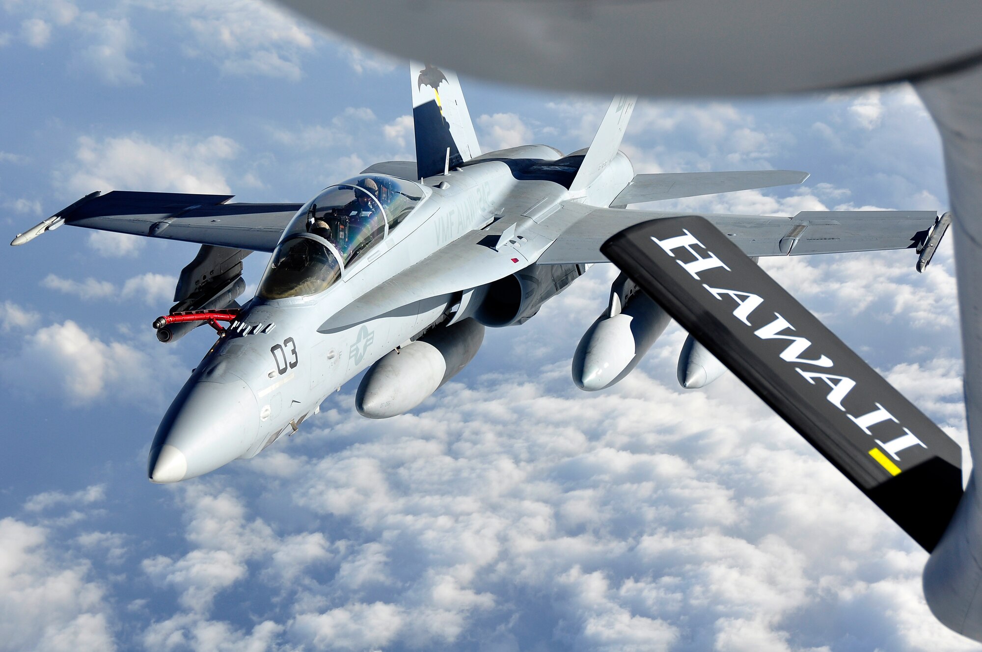 One of six Marine Corps F/A-18 Prowlers from Iwakuni Air Base, Japan, takes on fuel from a 96th Air Refueling Squadron KC-135 during a recent mission over the Pacific near Okinawa. This was the first off-station operational mission for the 96th ARS since it re-activated as a Total Force Integration active partner with the Hawaii Air National Guard?s 203rd ARS, July 23, 2010. The air refueling squadron plans to be fully operational as of March 1, 2011. (U.S. Air Force photo/Maj. Jeff Paget)