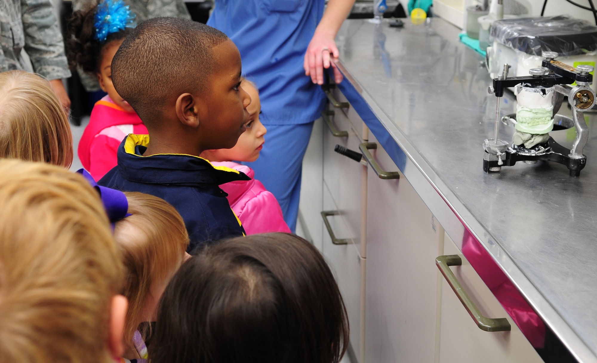 MOODY AIR FORCE BASE, Ga.-- Children from the Child Development learn how teeth molds are made Feb. 1. The 4- and 5-year-olds from the CDC were given a tour of the dental clinic and taught how to properly take care of their teeth. (U.S. Air Force photo/Senior Airman Stephanie Mancha)(RELEASED)