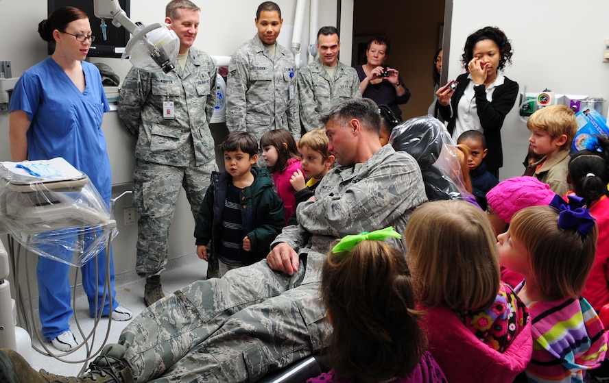 MOODY AIR FORCE BASE, Ga.-- Col. William DeMaso, 23rd Wing vice commander, talks to the children from the Child Development Center Feb. 1. about the importance of brushing and flossing their teeth. A health fair was held for the Child Development Center and offered free stickers, sugar-free lollipops, tooth brushes and a tour of the dental clinic as well as information on proper hygiene, diet and regular dental visits. (U.S. Air Force photo/Senior Airman Stephanie Mancha)(RELEASED)