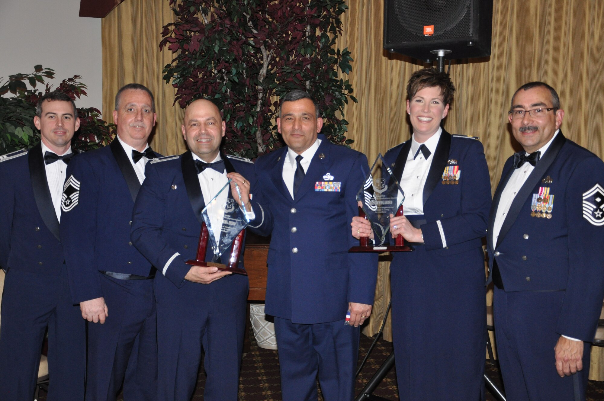 JOINT BASE MCGUIRE-DIX-LAKEHURST, N.J. -  Leadership of the 514th Maintenance Group and 514th Aircraft Maintenance Squadron show off the awards garnered at the 514th Air Mobility Wing Annual Awards Banquet held Jan. 29 at The Community Center, here. Both organizations are multi-year winners of the commander's  recognition program Freedom Wing Awards. (U.S. Air Force photo/Capt. Kelly Smyth)