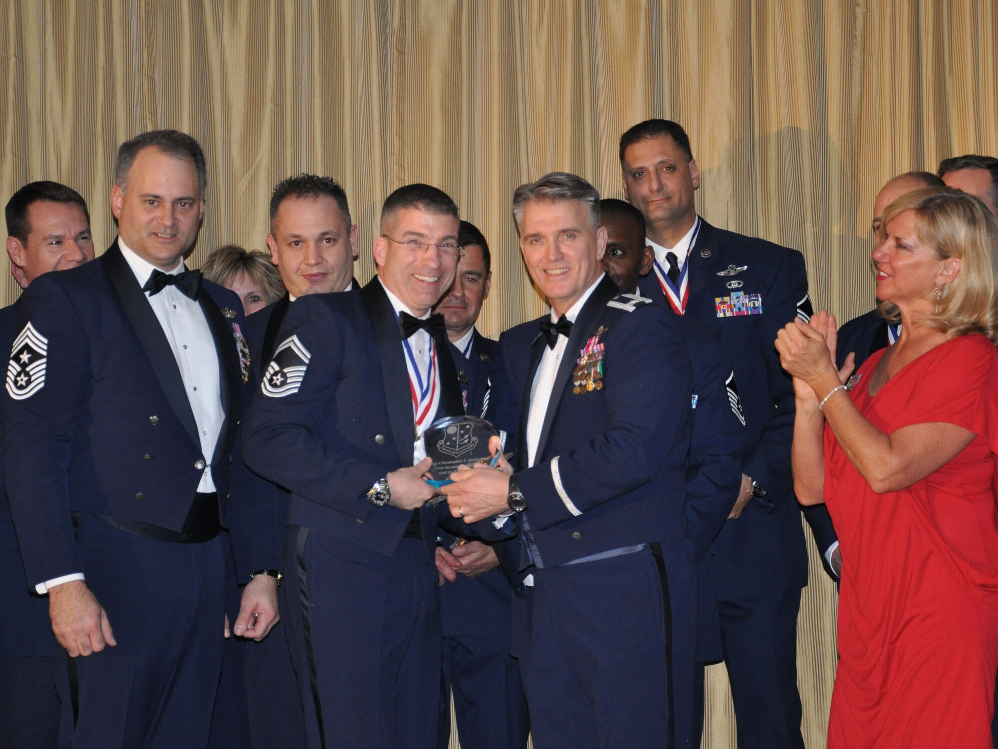 JOINT BASE MCGUIRE-DIX-LAKEHURST, N.J. - Col. Giordano McMullen, commander, 514th Air Mobility Wing announces Senior Master Sgt. Christopher Hofrichter as the recipient of the 2010 senior noncommissioned officer of the year award at the 514th Air Mobility Wing Annual Awards Banquet held Jan. 29 at The Community Center, here. (U.S. Air Force photo/Capt. Kelly Smyth)