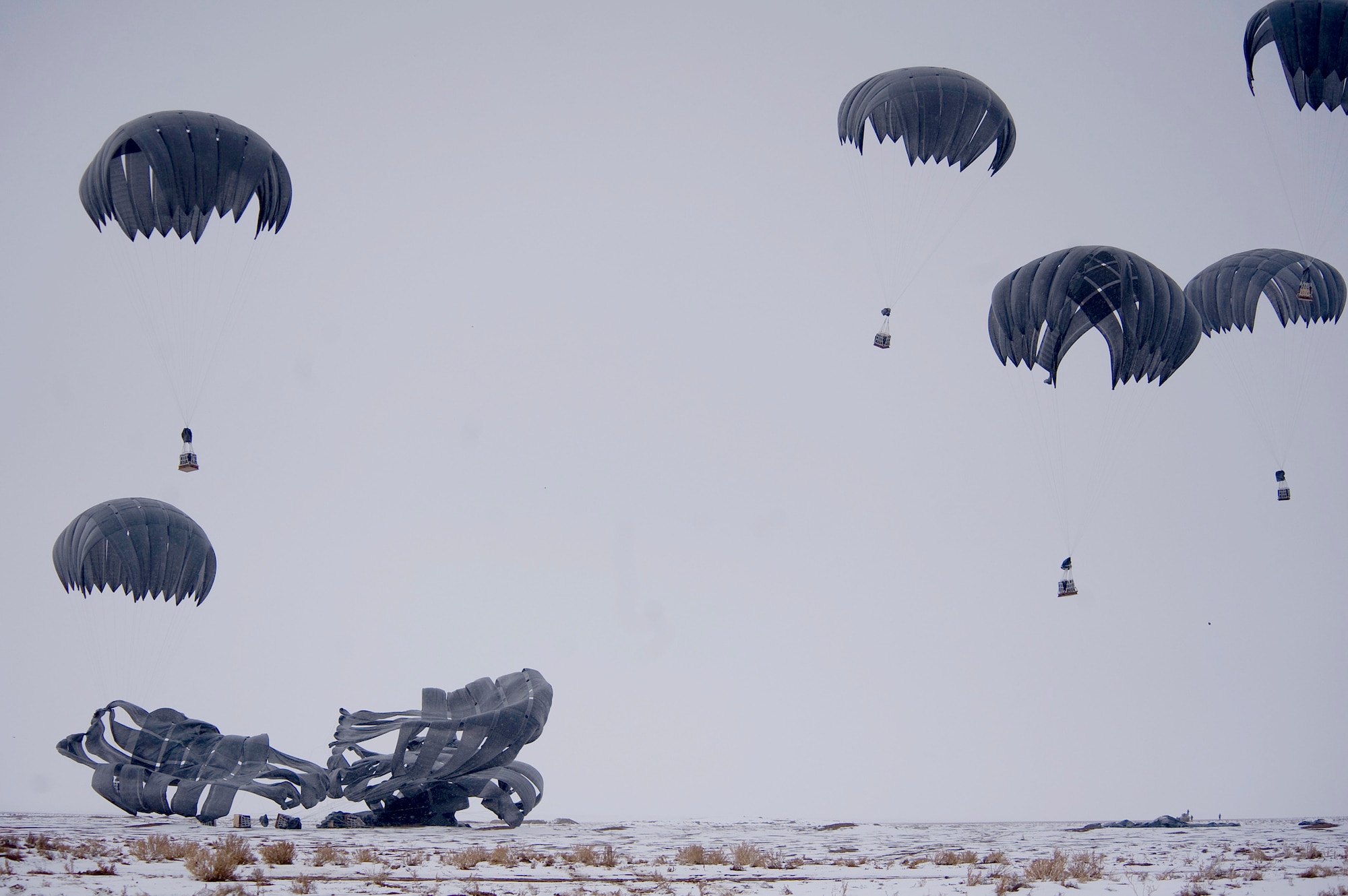 Bundles of fuel are air delivered recently to Forward Operating Base Waza K'wah in the Paktika province of Afghanistan. The fuel was part of a C-17 Globemaster III air delivery to help sustain members of Task Force Currahee, 4th Brigade, 101st Airborne Division, whose only means of re-supply is through air delivery. (U.S. Air Force photo/Master Sgt. Adrian Cadiz)