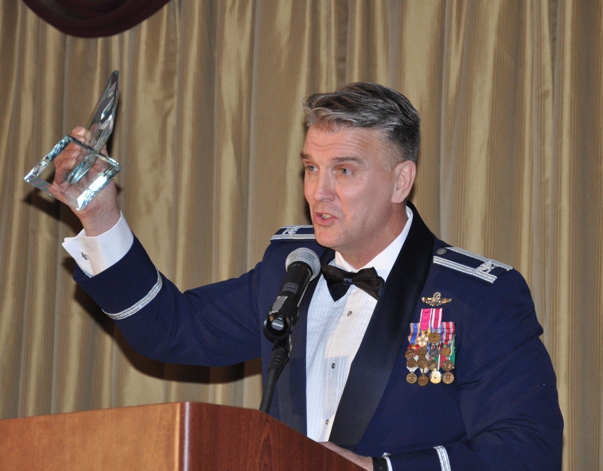 JOINT BASE MCGUIRE-DIX-LAKEHURST, N.J. - Col. Giordano McMullen, commander, 514th Air Mobility Wing announces the winners of the 2010 awards at the wing's Annual Awards Banquet held Jan. 29 at The Community Center, here.  (U.S. Air Force photo/Capt. Kelly Smyth)