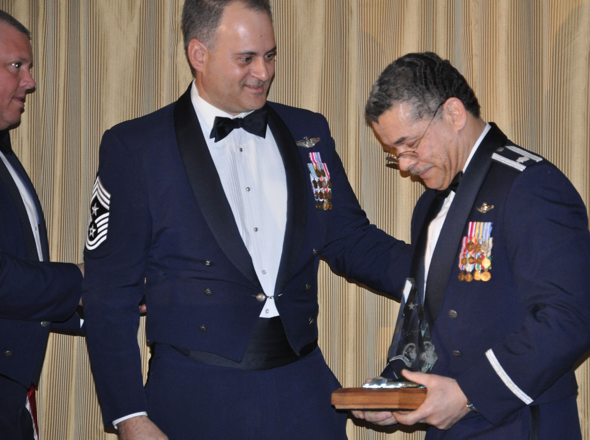 JOINT BASE MCGUIRE-DIX-LAKEHURST, N.J. - Lt. Col. Raymond Douglas, executive officer, 514th Air Mobility Wing (right), is overcome after being named the recipient for 2010 of the Gen. Joseph A. McNeil Award at the 514th Air Mobility Wing Annual Awards Banquet held Jan. 29 at The Community Center, here.  (U.S. Air Force photo/Capt. Kelly Smyth)
