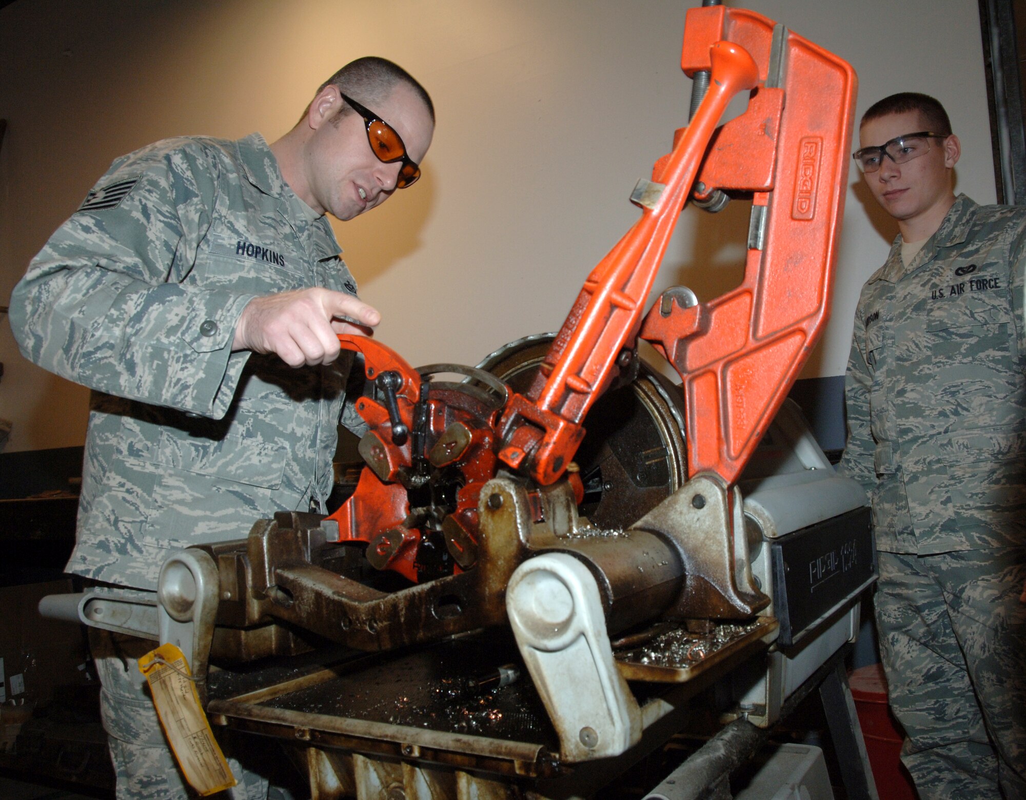 Tech. Sgt. Mark Hopkins, 319th Civil Engineering Squadron, works the civil engineering shop’s pipe-fitting machine Jan. 27. Sergeant Hopkins is the Warrior of the Week for Feb. 2 through 9. Warrior of the Week recognizes everyday Airmen working their every day job. (U.S. Air Force photo by Airman Derek VanHorn)