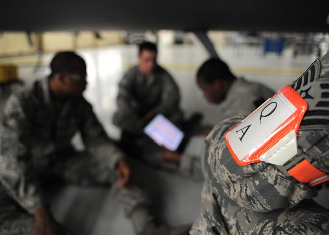 Tech. Sgt. Jonathan Wilson inspects Airmen from the 437th Aircraft Maintenance Squadron during a personal evaluation inspection here Feb. 1. The 437th Maintenance Group, the 315th Maintenance Group and the 628th Logistics Readiness Squadron are preparing for a Logistics Compliance Assessment Program inspection scheduled for Feb. 4.  Sergeant Wilson is a quality assurance inspector with the 437th Maintenance Operations Squadron. The QA office performs over 300 inspections monthly. (U.S. Air Force photo/Senior Airman Katie Gieratz)(RELEASED)