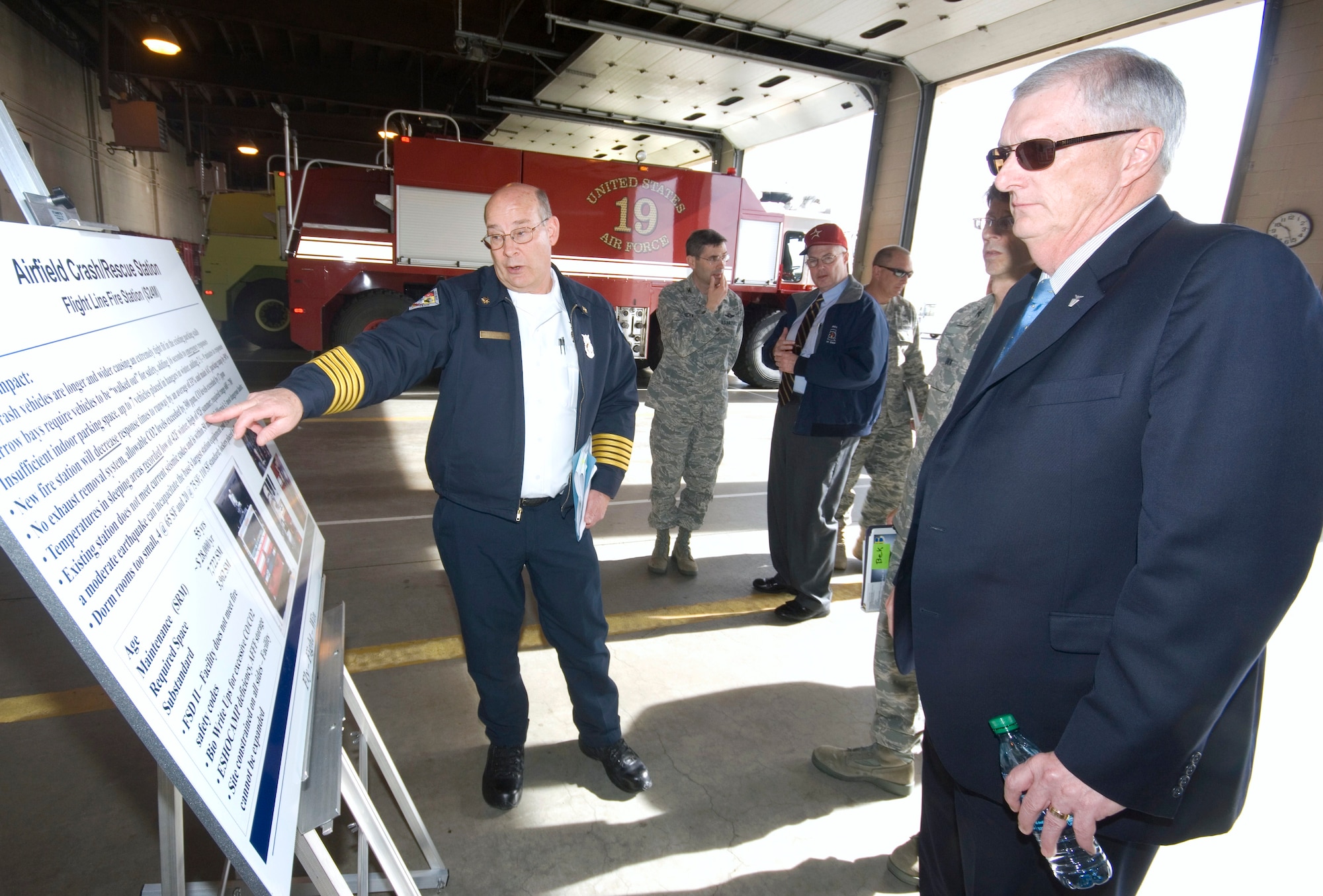 Chief Michael Hurles, 95th Air Base Wing fire department, briefs Paul Parker, Air Force Materiel Command Communications, Installations and Mission Support director, on requirements necessary for the proposed construction of a replacement fire station, located closer to the middle of Ramp 1. Mr. Parker visited the base Jan. 18 through Jan. 21 and toured the fire department, Rosburg Fitness Center, Civil Engineering office and Air Force Research Laboratory Detachment 7, among others. (Air Force photo by Rob Densmore)
