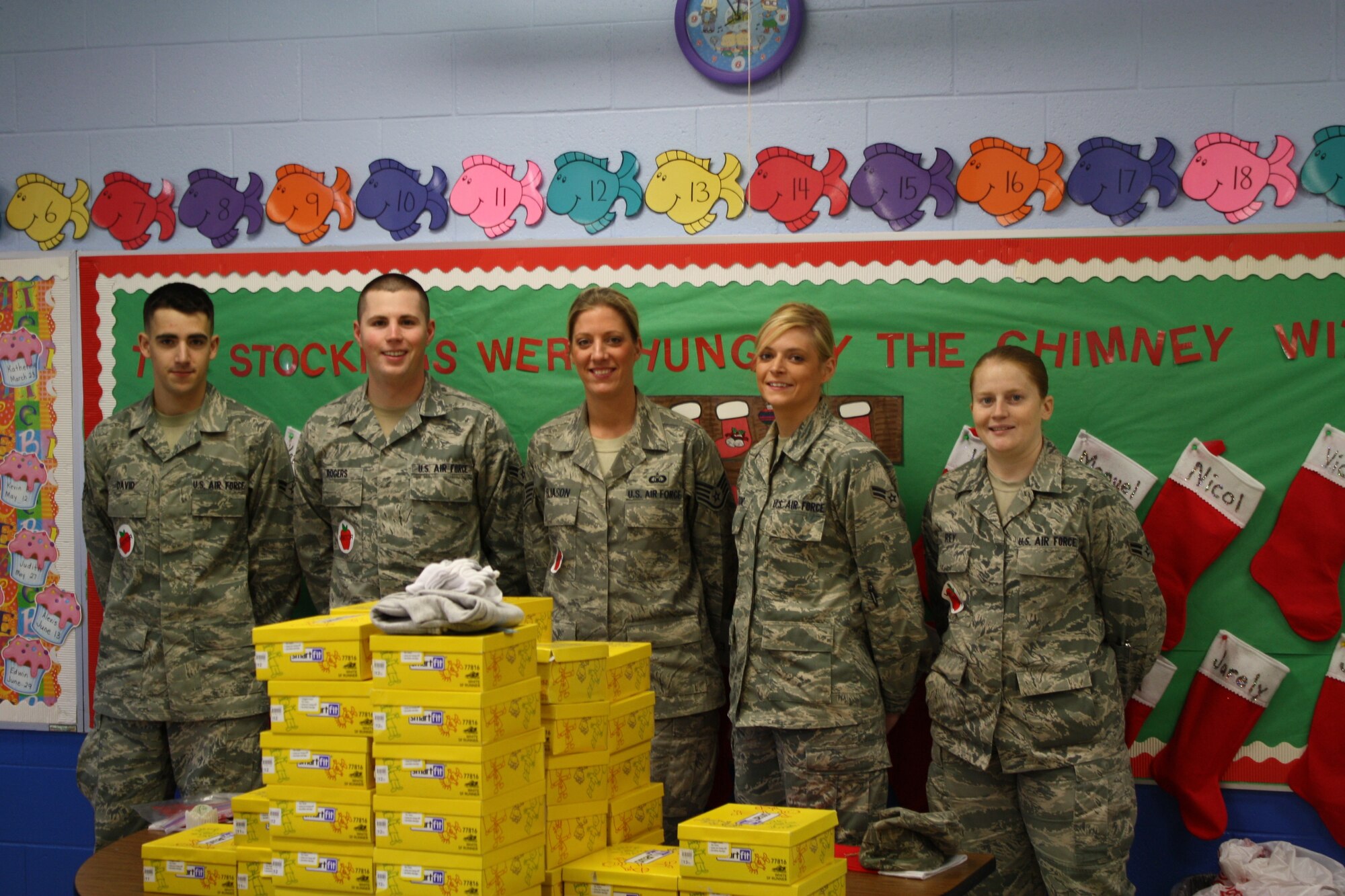 ALBERTSON, N.C. – Air traffic controllers from the 4th Operation Support Squadron stand with boxes of sneakers they donated to B.F. Grady Elementary School. The Airmen (from left to right) Airman 1st Class Anthony David, Senior Airman Matthew Rogers, Staff Sgt. Katherine Eliason, Airman 1st Class Hannah Victor and Airman 1st Class Stephanie Rey coordinated a fundraiser to purchase the sneakers after learning some area elementary students were not able to thoroughly enjoy their recess time because they did not decent shoes. (Courtesy photo)