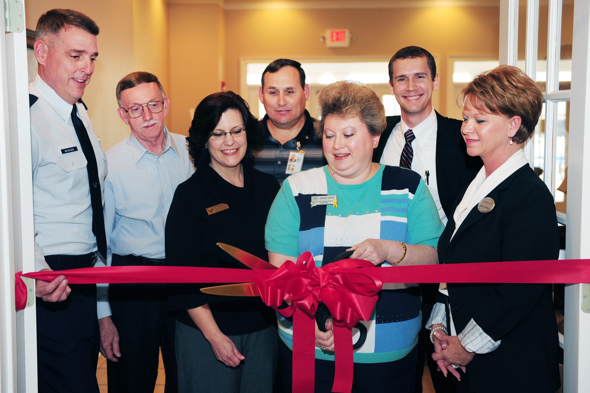 Col. Mike Minihan, 19th Airlift Wing commander, and the housing referral team cut the ribbon for the new location of the housing referral office Jan. 31, 2011, at the Welcome Center at Little Rock Air Force Base, Ark. The new location consolidates the housing referral office and Landings at Little Rock for one-stop shopping for a new home at Little Rock Air Force Base. The school liaison is also located at the Welcome Center. (Photo by U.S. Air Force Senior Airman Jim Araos)