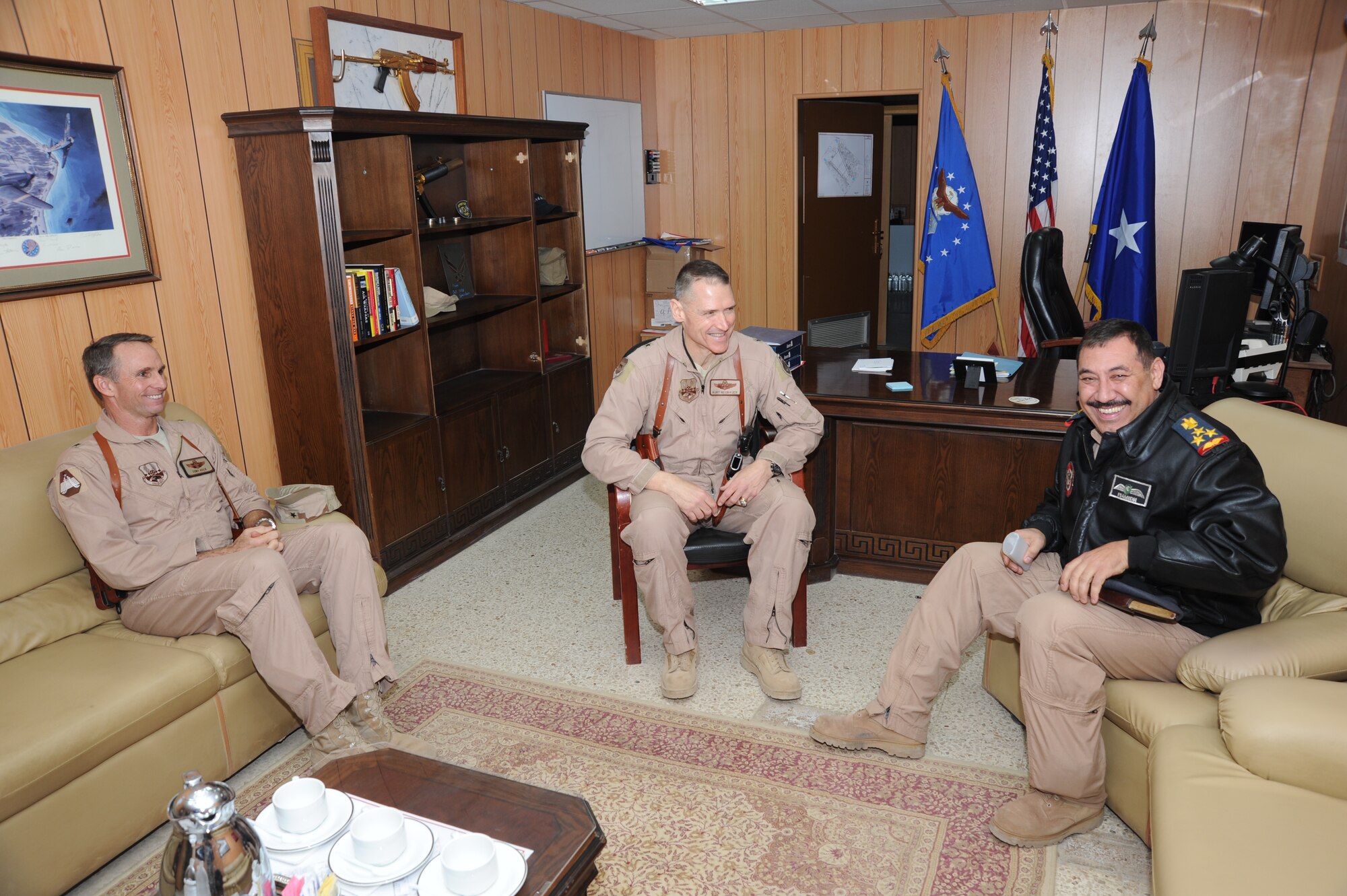 JOINT BASE BALAD, Iraq -- (l-r) Brig. Gens.  Anthony Rock, 321st Air Expeditionary Wing commander and Kurt Neubauer, 332nd Air Expeditionary Wing commander, share a moment with General Ramid, director of plans, programs and policies for the Iraqi air force. General Ramid and other U.S. and Iraqi key leaders came together to view the base and operations during JBB’s transitional phase. (U.S. Air Force photo/Staff Sgt. Keyonna Fennell)