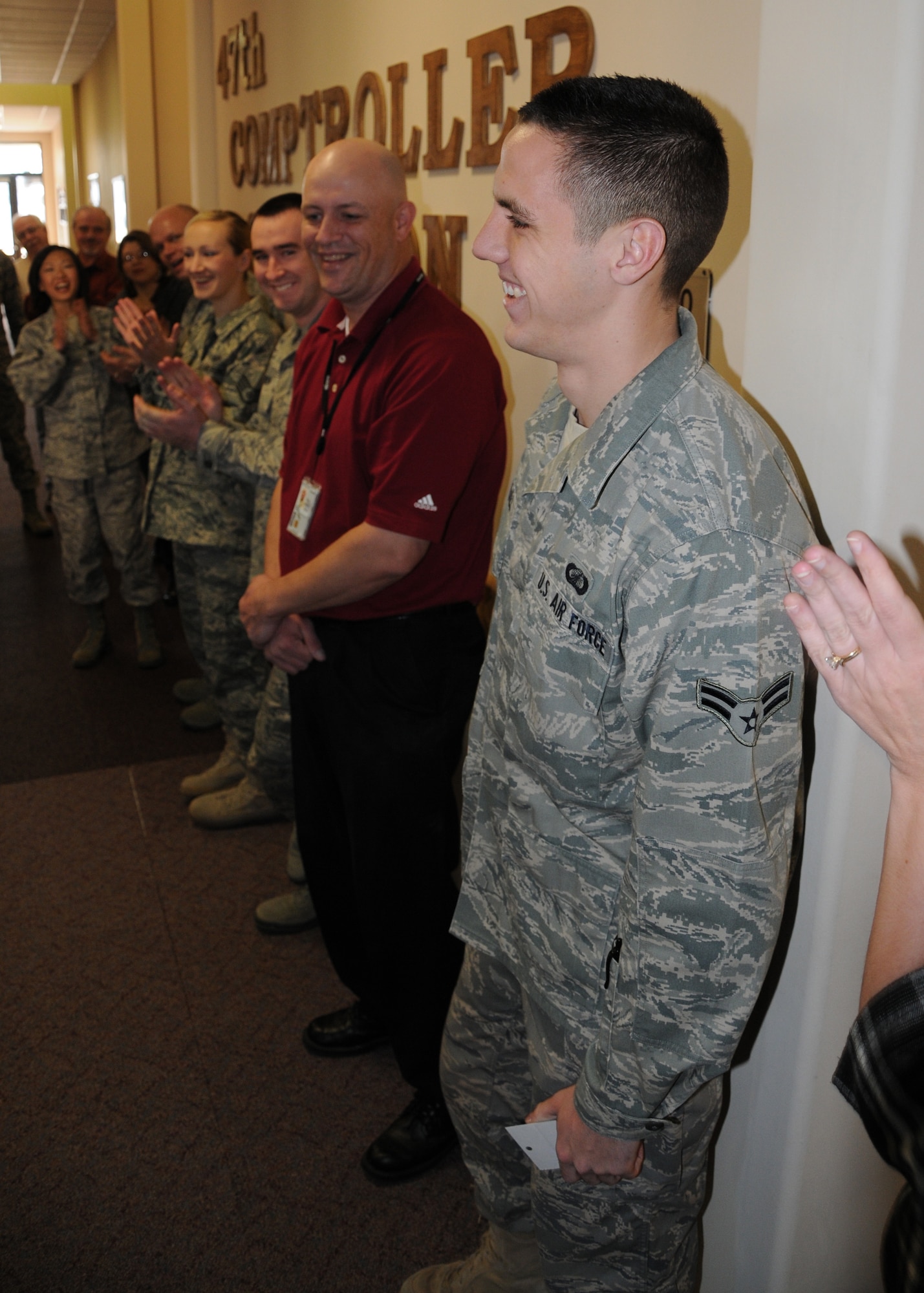 LAUGHLIN AIR FORCE BASE, Texas – Airman 1st Class Tyler Sumrall, 47th Comptroller Squadron, is applauded after being notified that he had been awarded a college scholarship through the Airman Scholarship Commissioning Program. Airman Sumrall will attend Arizona State University and study political science while participating in ASU’s Reserve Officer Training Corp program. (U.S. Air Force photo by Airman 1st Class Blake Mize)
