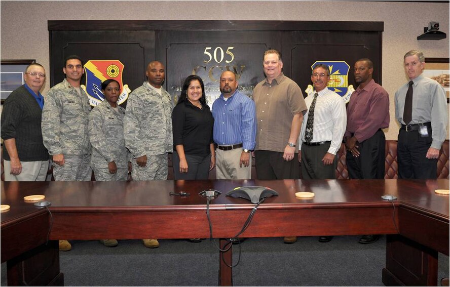 505th Command and Control Wing 2010 Team of the Year Contracting and Financial Management Cross Functional Team, from left, Rich Foust, Maj. Jorge Jimenez, Capt. Ayanna Brown, Capt. Darryl Randolph, Diana Kendall, Eric Lingad, Sam Doswell, Carl Ledford, Sammie Selby and Laurence Clark, 505th Command and Control Wing Staff, Hurlburt Field, Fla.