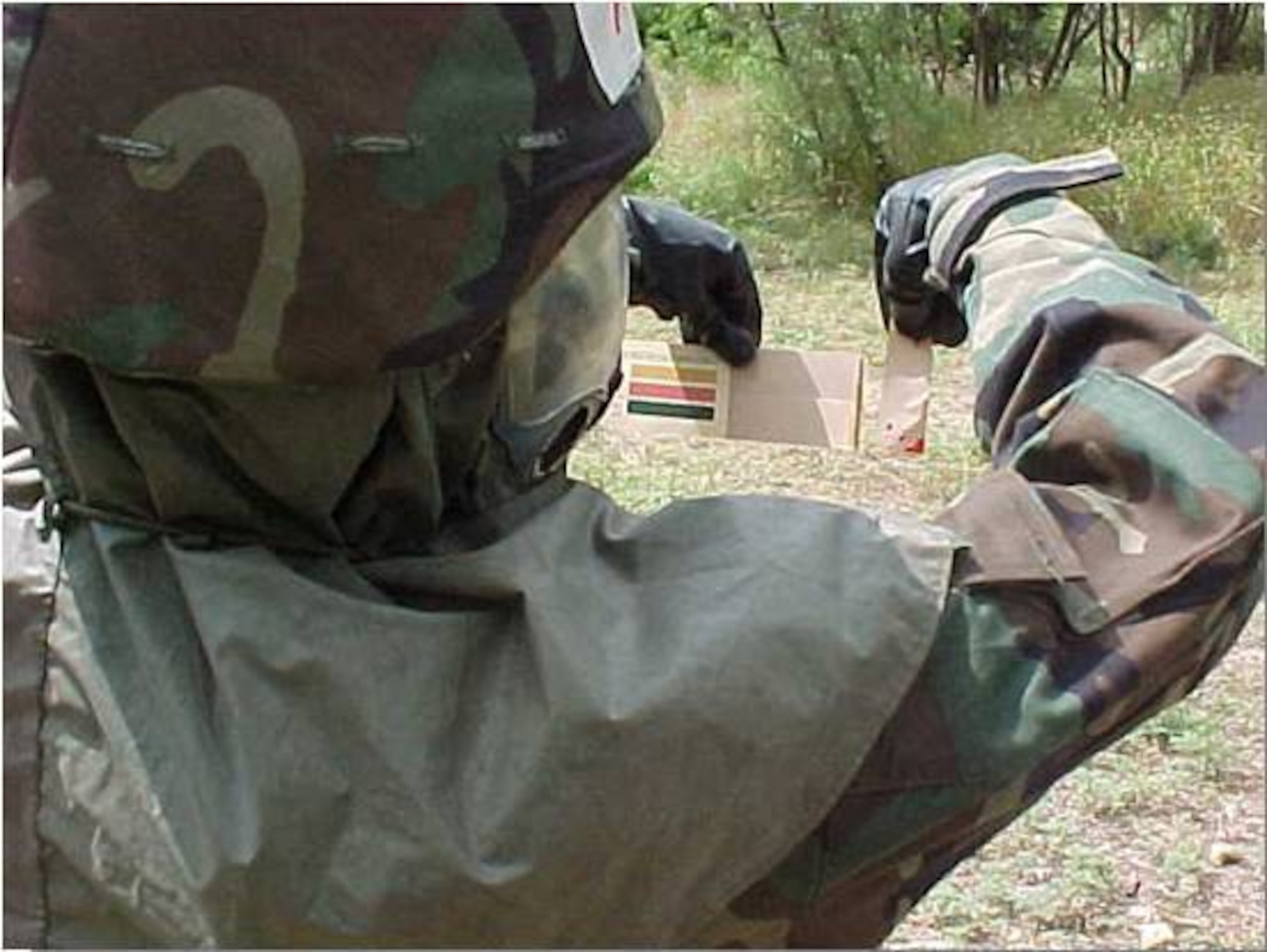 KUNSAN AIR BASE, Republic of Korea -- An Airman reviews an M8 paper book to identify the chemical agent on the Airman's M8 paper. (Courtesy photo)