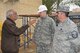 Capt. Joshua Poulton, facility engineer team leader, and Master Sgt. Erik Forestell, FET NCO in charge, 467 Air Expeditionary Group, talks with an Iraqi contractor to ensure the construction is up to code at Forward Operating Base Union III, International Zone, Baghdad, Iraq, Jan. 29, 2011. (Air Force photo by Senior Master Sgt. Larry Schneck/Released)