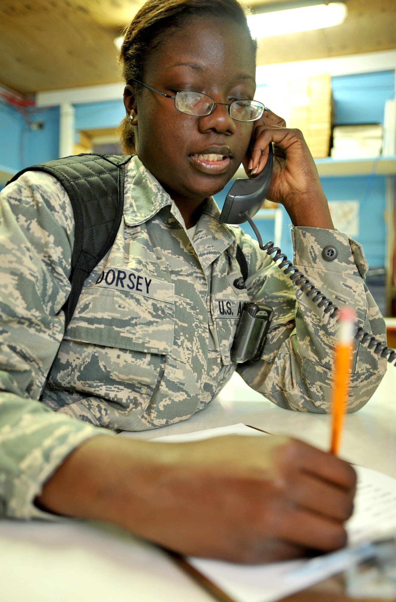 Airman 1st Class Shanita Dorsey, 467th Casualty Liaison Team member, fills out a CLT support form while receiving a patients information on the phone Jan.26, 2011, on Contingency Operating Base Speicher, Iraq. (U.S. Air Force photo by Senior Airman Andrew Lee/Released) 