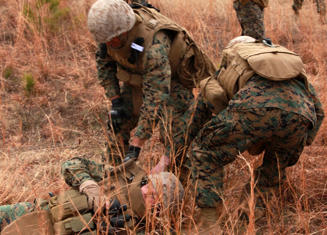 Cpl. Michael E. Gabriel, a team member with Personal Security Detail, 2nd Marine Logistics Group (Forward), investigates a potential mock Improvised Explosive Device during a mine sweeping and IED awareness exercise aboard Camp Lejeune, N.C., Feb. 3, 2011. The Marines searched for possible IED and mine threats while conducting foot patrols simulating the same obstacles they may face in Afghanistan. (U.S. Marine Corps photo by Lance Cpl. Bruno J. Bego)