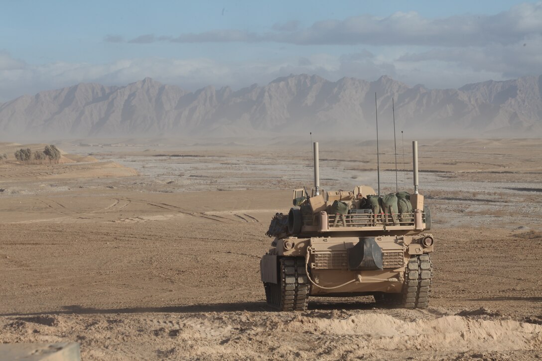 An M1A1 Abram tank with 1st Platoon, Delta Company, 1st Tank Battalion attached to Company L, Battalion Landing Team 3/8, 26th Marine Expeditionary Unit, Regimental Combat Team 2, provides security over-watch near Combat Outpost Ouellette, Helmand province, Afghanistan, Feb. 3, 2011. Elements of the 26th Marine Expeditionary Unit deployed to Afghanistan to provide regional security in Helmand province in support of the International Security Assistance Force. (U.S. Marine Corps photo by Sgt. Jesse J. Johnson/Released)