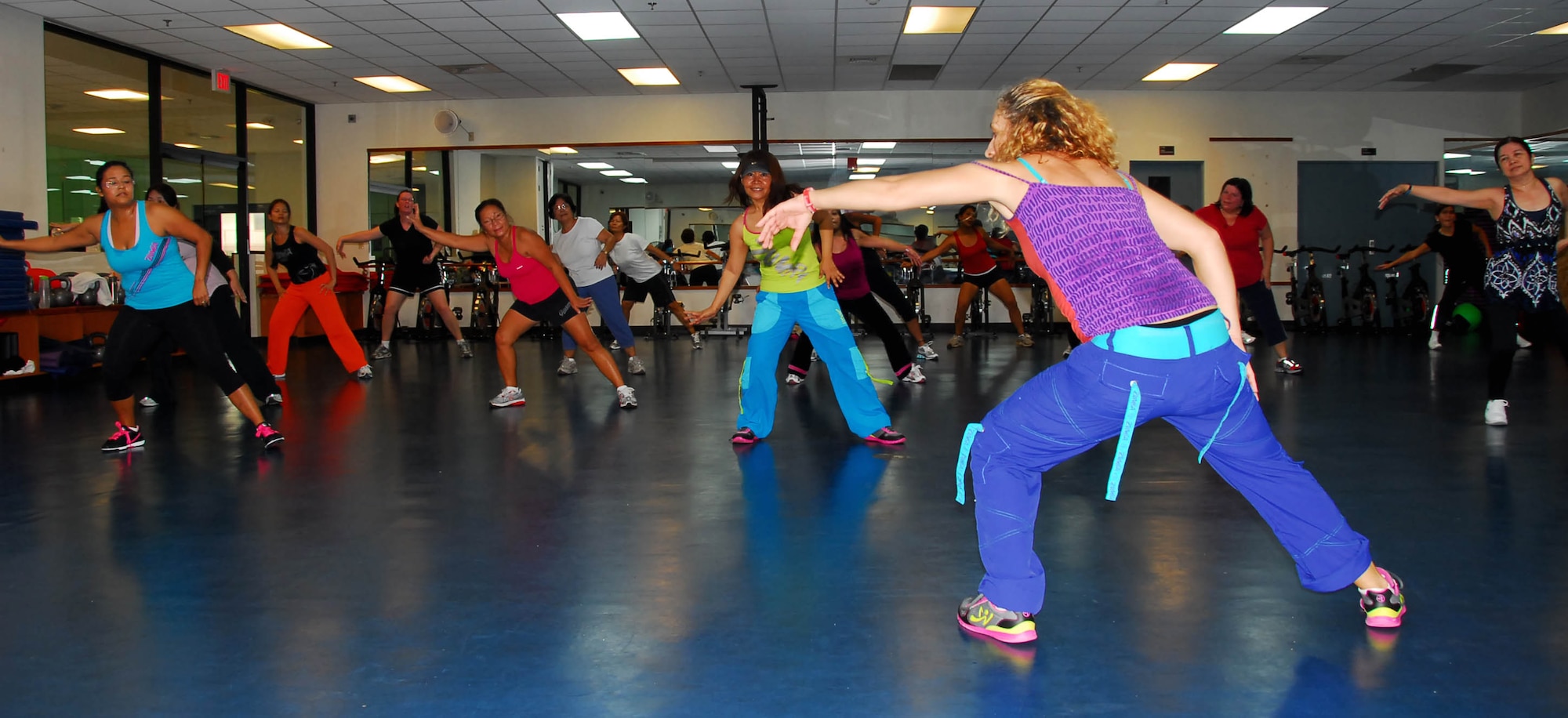 Members of Team Andersen dance to recent hits during a Zumba class at the Coral Reef Fitness Center here Jan. 27. Zumba fuses Latin and international music into a one-hour, cardio packed fitness experience. Zumba is offered at the CRFC Mondays, Wednesdays and Thursdays at 7 p.m., Tuesdays and Thursdays at 9:30 a.m. and Fridays at 5 p.m. (U. S. Air Force photo by Airman First Class Whitney Tucker)