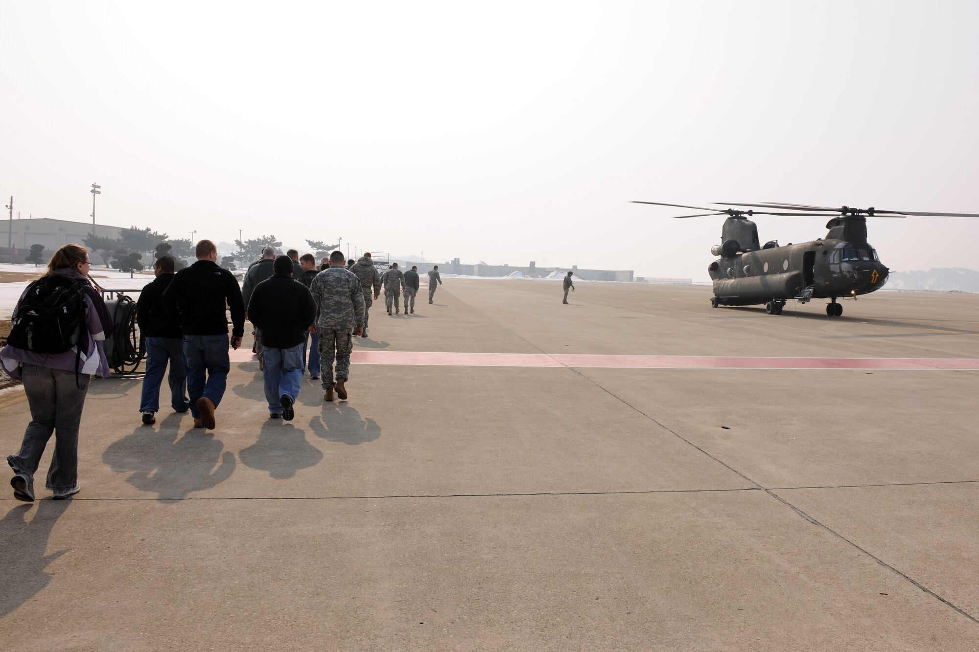 KUNSAN AIR BASE, Republic of Korea -- Members of the 8th Fighter Wing prepare to board an Army CH-47 Chinook helicopter for an incentive flight Feb. 3.  The flight was provided by the Bravo Company 32, Ground Support Aviation Battallion stationed at United States Army Garrison Humphreys, ROK.(U.S. Air Force photo/Tech. Sgt. Jonathan Pomeroy)
