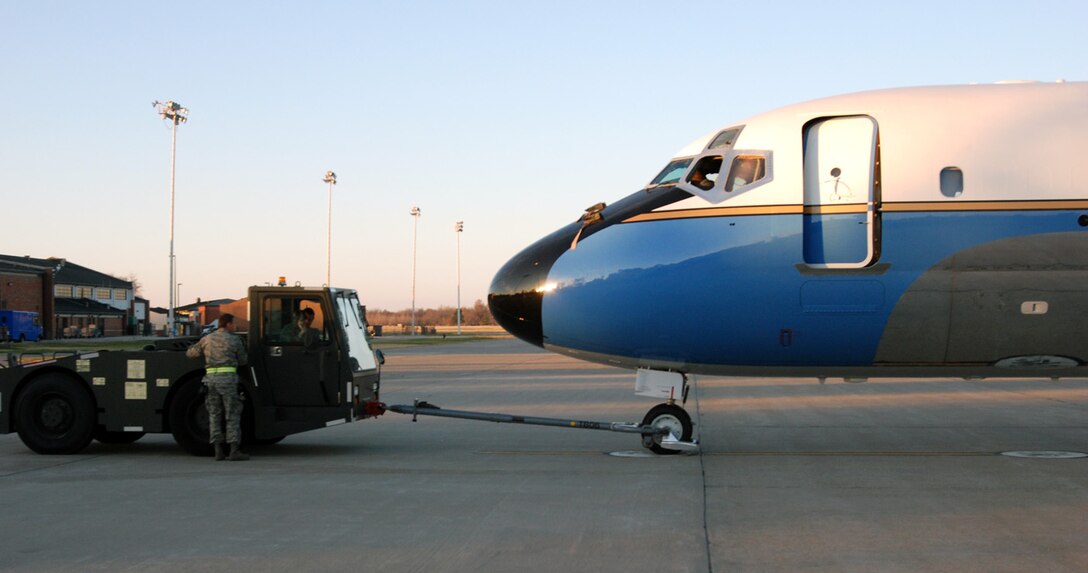 932nd Airlift Wing maintainers prepare to tow an Air Force Reserve Command C-9C aircraft to the hangar before sunset.  The men and women of the 932nd Maintenance Group take care of three C-9C and three C-40C planes.  (U.S. Air Force photo/Maj. Stan Paregien)