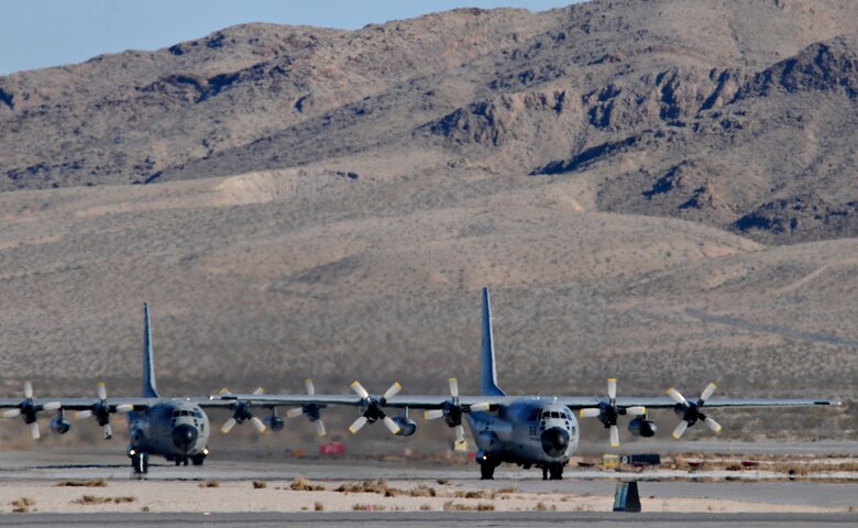 NELLIS AIR FORCE BASE, Nev. -- Two C-130 Hercules from the Belgium air force's 20 Squadron taxi on the flightline Feb. 2 after completing a mission in Red Flag 11-2. The C-130s deployed from Melsbroek Air Base, Belgium, to participate in the combined exercise that provides a realistic combat training environment to the U.S. and its allies. (U.S. Air Force photo/Staff Sgt. Benjamin Wilson)
