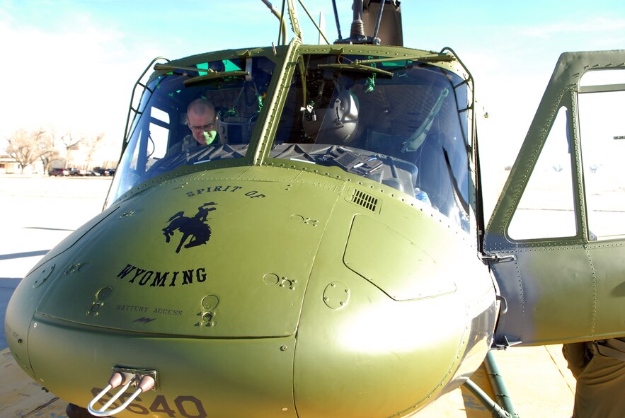 Helicopter pilot Capt. Barrett Vandegrift, 37th Helicopter Squadron, performs preflight checks prior to a flight taking part in a base exercise Jan. 27. (U.S. Air Force photo by R.J. Oriez)