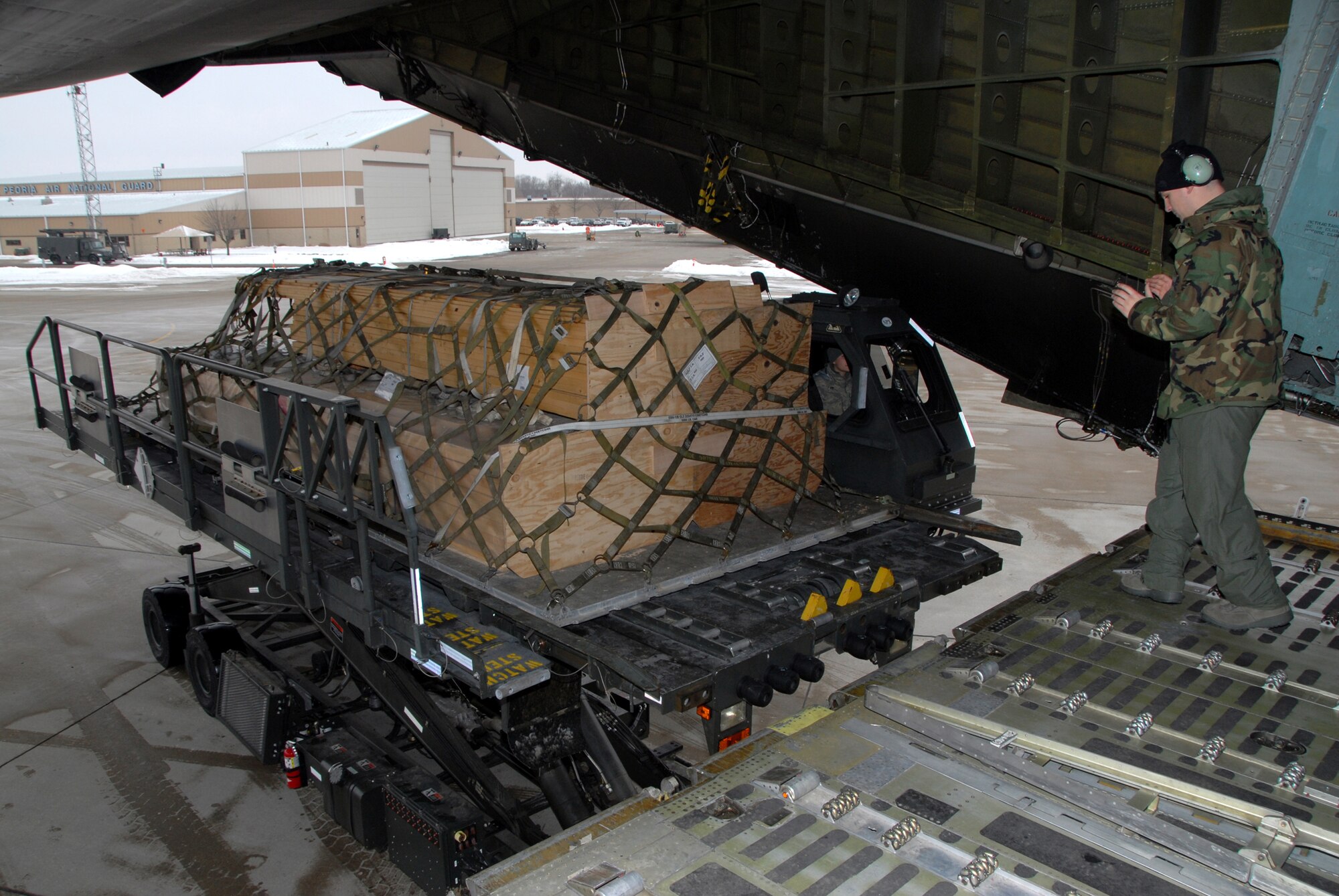 WRIGHT-PATTERSON AIR FORCE BASE, Ohio – A 445th Airlift Wing C-5 Galaxy delivered more than 99,000 pounds of construction material and dry food items to Joint Base Charleston, S.C, Jan. 28. The unit picked up the donated goods from the Illinois Air National Guard base in Peoria, Ill.  The materials are in support of the on-going relief efforts in Haiti and will be delivered to Haiti by a cargo aircraft from Charleston.  (U.S. Air Force photo/Tech. Sgt. Anthony Springer)