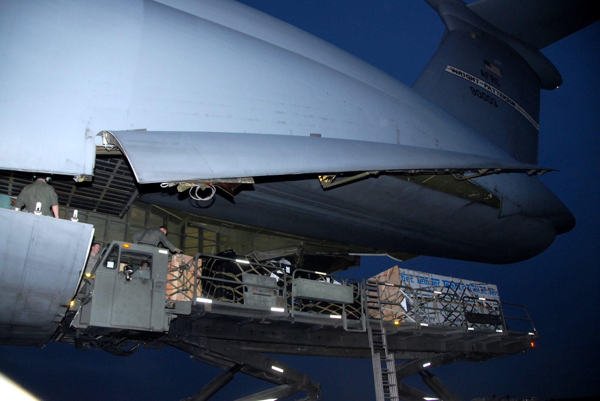 WRIGHT-PATTERSON AIR FORCE BASE, Ohio – A 445th Airlift Wing C-5 Galaxy delivered more than 99,000 pounds of construction material and dry food items to Joint Base Charleston, S.C, Jan. 28. The unit picked up the donated goods from the Illinois Air National Guard base in Peoria, Ill.  The materials are in support of the on-going relief efforts in Haiti and will be delivered to Haiti by a cargo aircraft from Charleston.  (U.S. Air Force photo/Tech. Sgt. Anthony Springer)