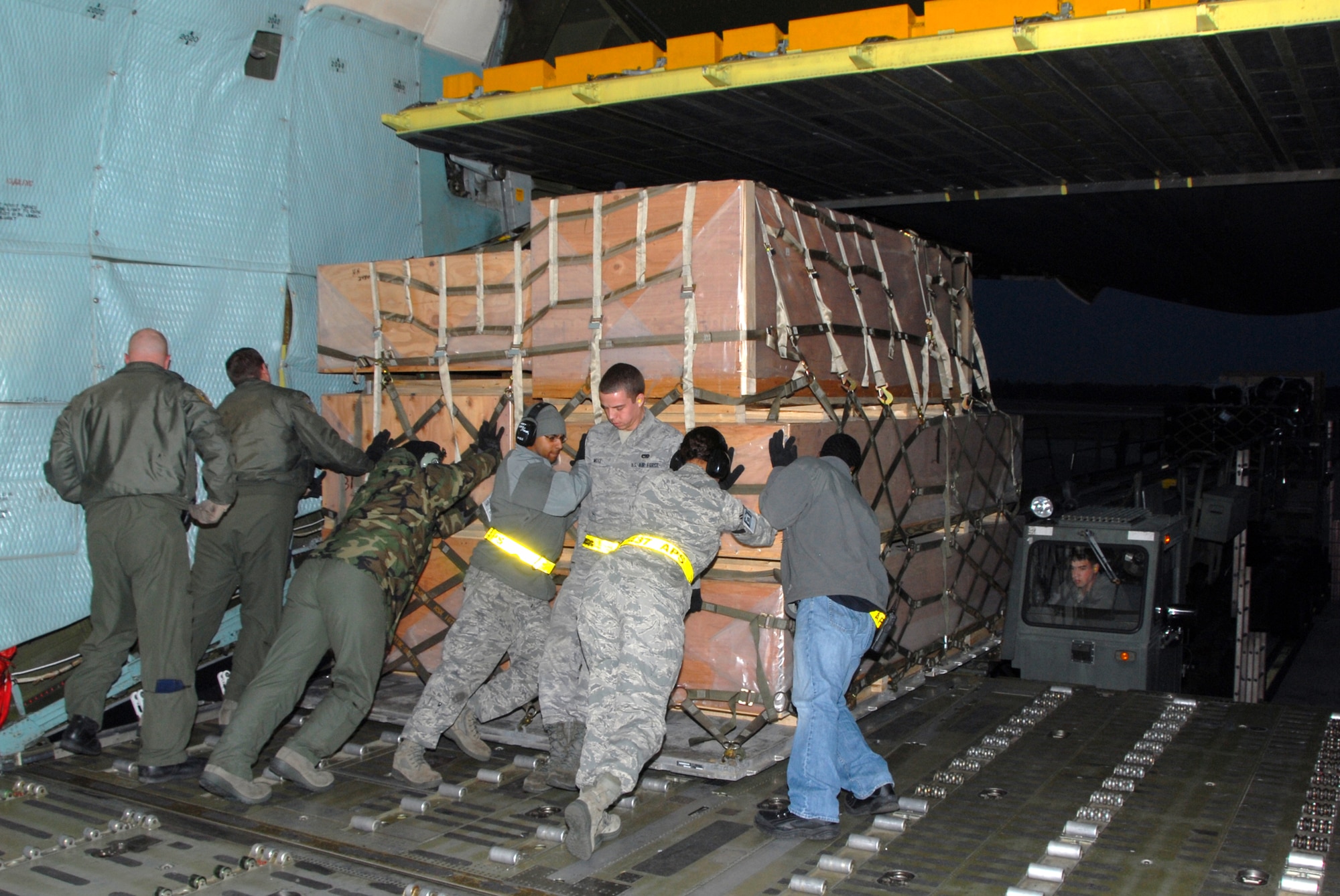 WRIGHT-PATTERSON AIR FORCE BASE, Ohio – A 445th Airlift Wing C-5 Galaxy delivered more than 99,000 pounds of construction material and dry food items to Joint Base Charleston, S.C, Jan. 28. The unit picked up the donated goods from the Illinois Air National Guard base in Peoria, Ill.  The materials are in support of the on-going relief efforts in Haiti and will be delivered to Haiti by a cargo aircraft from Charleston.  (U.S. Air Force photo/Tech. Sgt. Anthony Springer)
