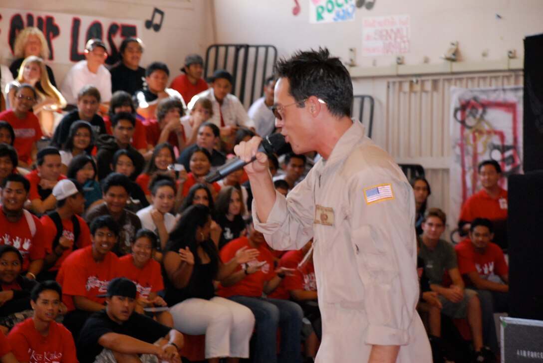 SSgt John Kukan performs with the USAF Band of the Pacific-Hawaii on the Island of Maui.  Students of Lahaina-Luna High School enjoyed the current repetoire of the group, which included SSgt kukan's ukulele playing and the occasional rap.