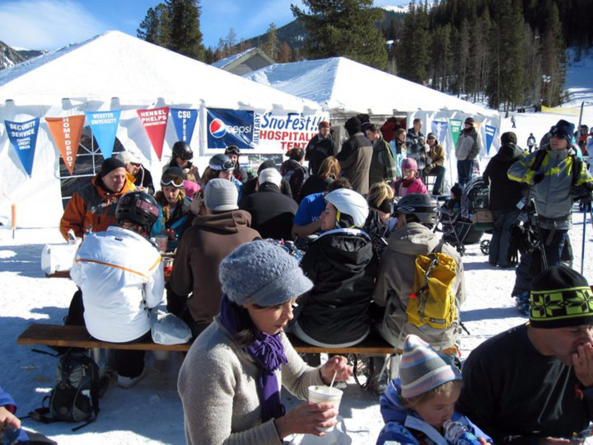 Military members and their families enjoy refreshments at the SnoFest hospitality tent Jan. 29. The hospitality tent provided servicemembers free snacks, drinks and information. (Courtesy Image)