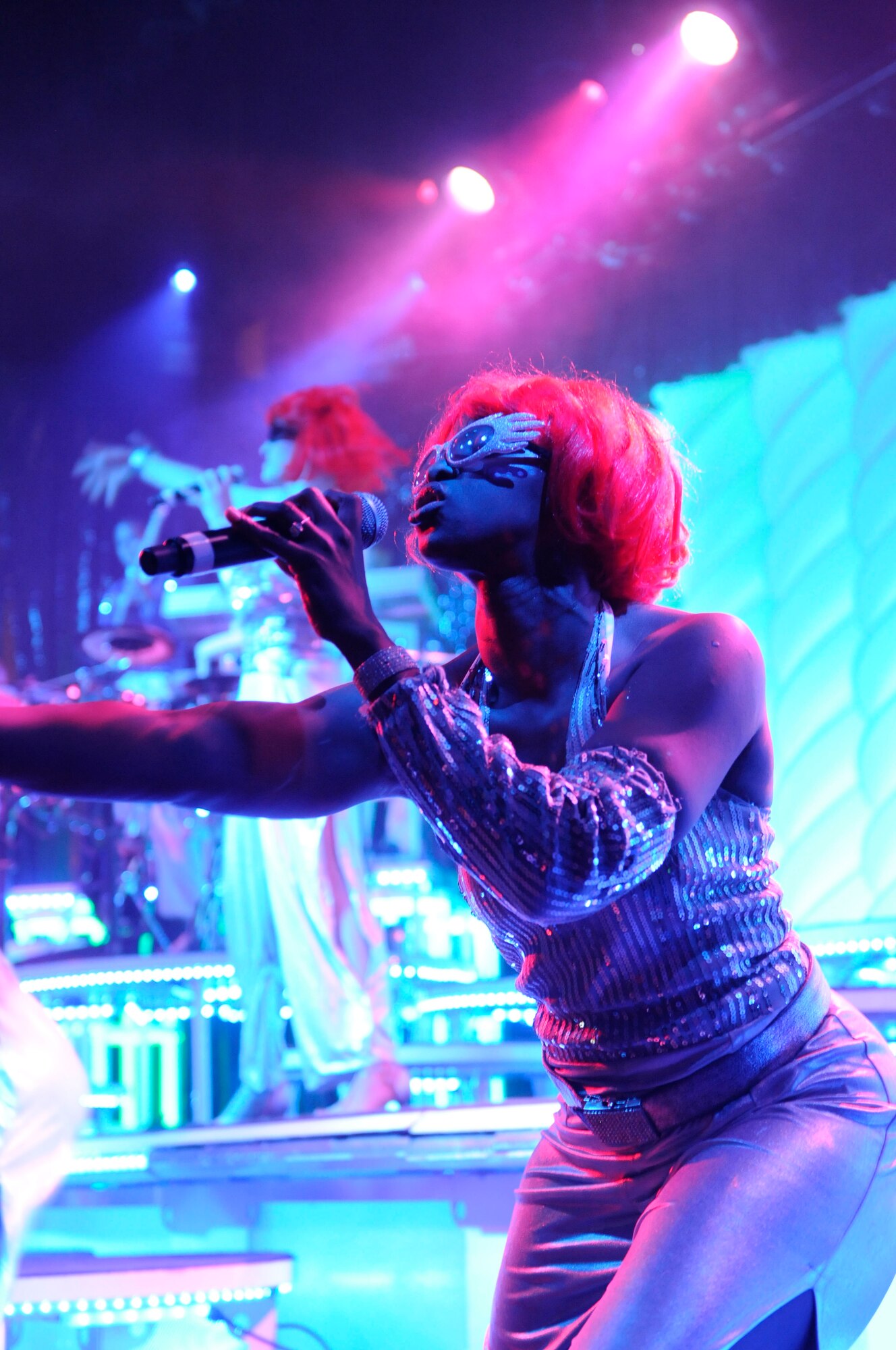 Tech. Sgt. Letisia Eddy, a performer with the Air Force’s Tops in Blue special unit, entertains the crowd at Talkeetna Theater, Saturday. The musicians performed acts ranging from country music to over-the-top tributes to Lady Gaga. (U.S. Air Force photo/Seven White)