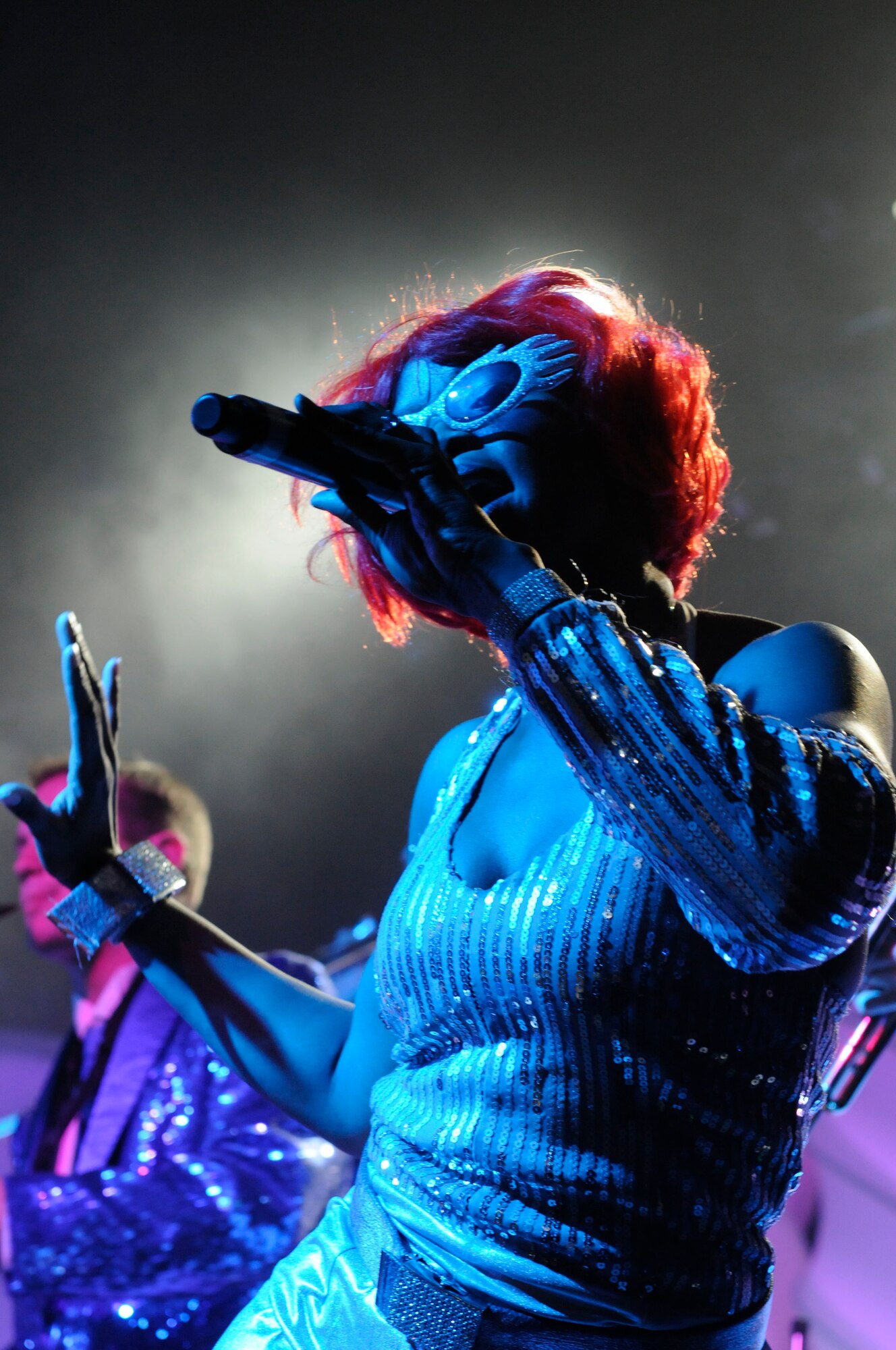 Tech. Sgt. Letisia Eddy, a performer with the Air Force’s Tops in Blue special unit, entertains the crowd at Talkeetna Theater, Saturday. The musicians performed acts ranging from country music to over-the-top tributes to Lady Gaga.(U.S. Air Force photo/Steve White)