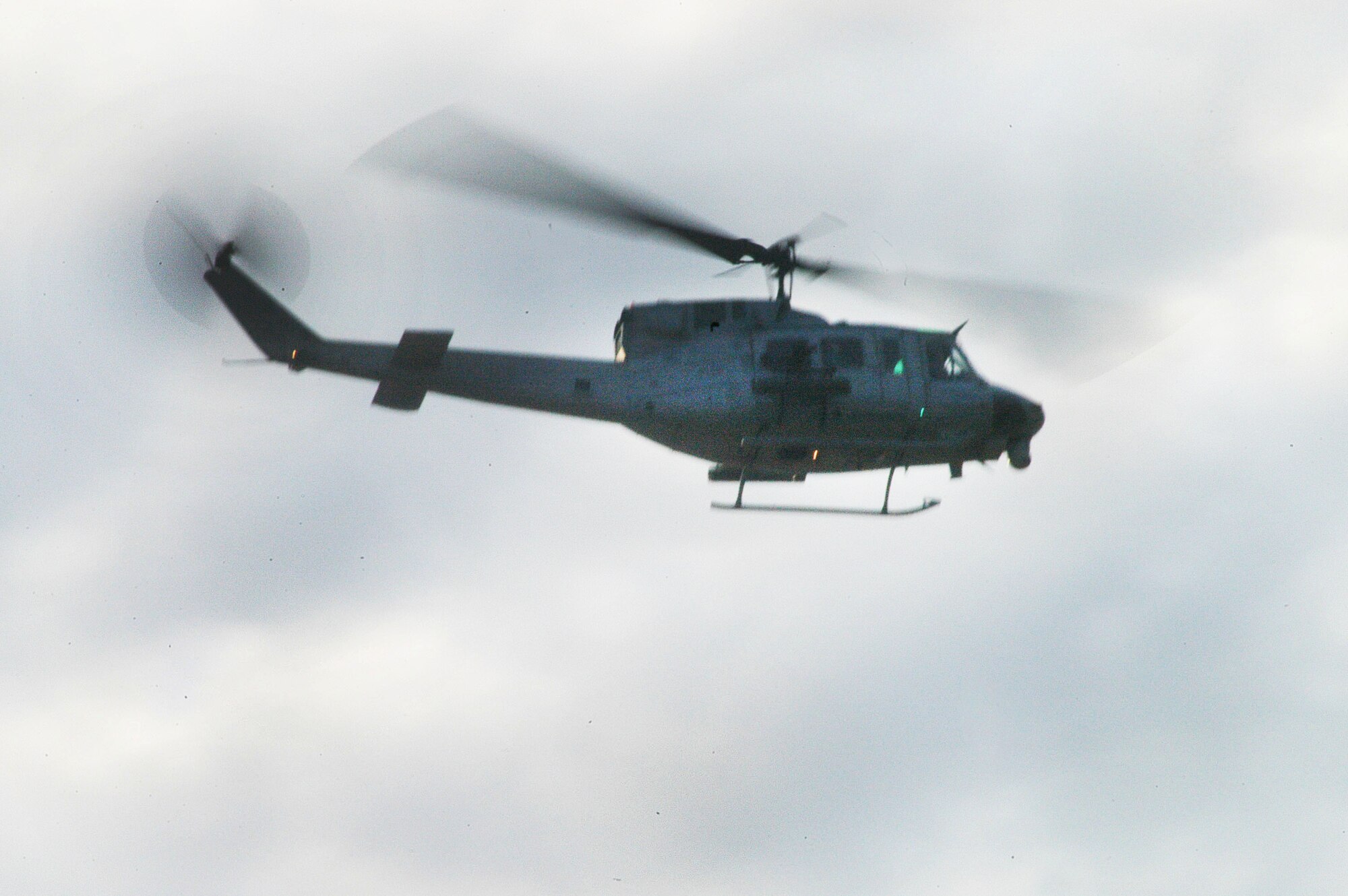 A UH-1N Huey helicopter flies during training exercises of  Light Attack Squadron 773, the Marine helicopter squadron which relocated to Robins last summer. U. S. Air Force photo by Sue Sapp