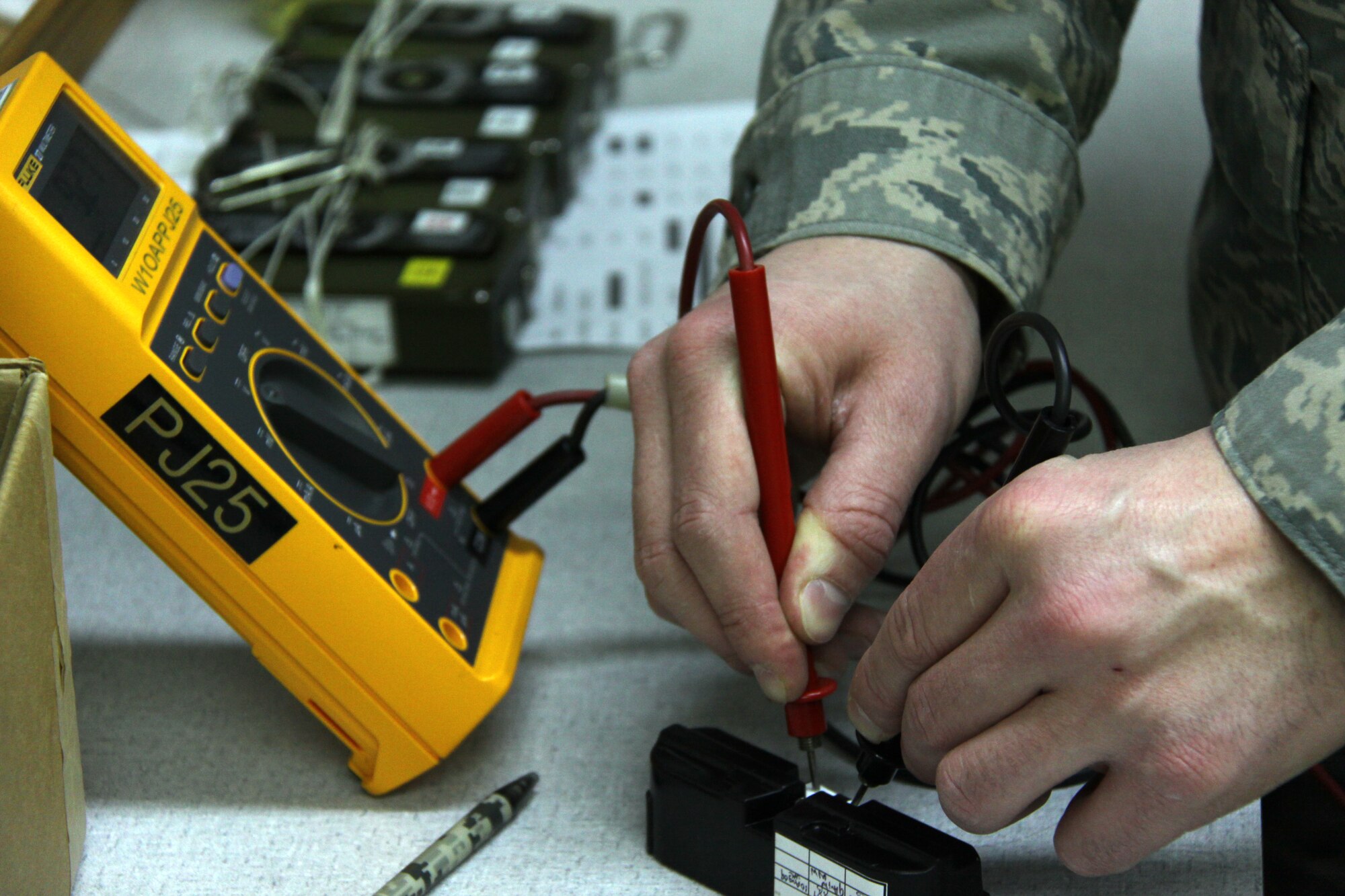 Staff Sgt.  Matt Walsh, an aircrew flight equipment specialist, 911th Operations Support Squadron, conducts a check on the battery of an emergency beacon using a digital multimeter here, Feb. 2. The tests are needed in order to ensure that the emergency locator beacons are functional in the event of an emergency where aircrew would need to exit the C-130H aircraft by parachute. The beacons allow for rescue forces to find the aircrew.