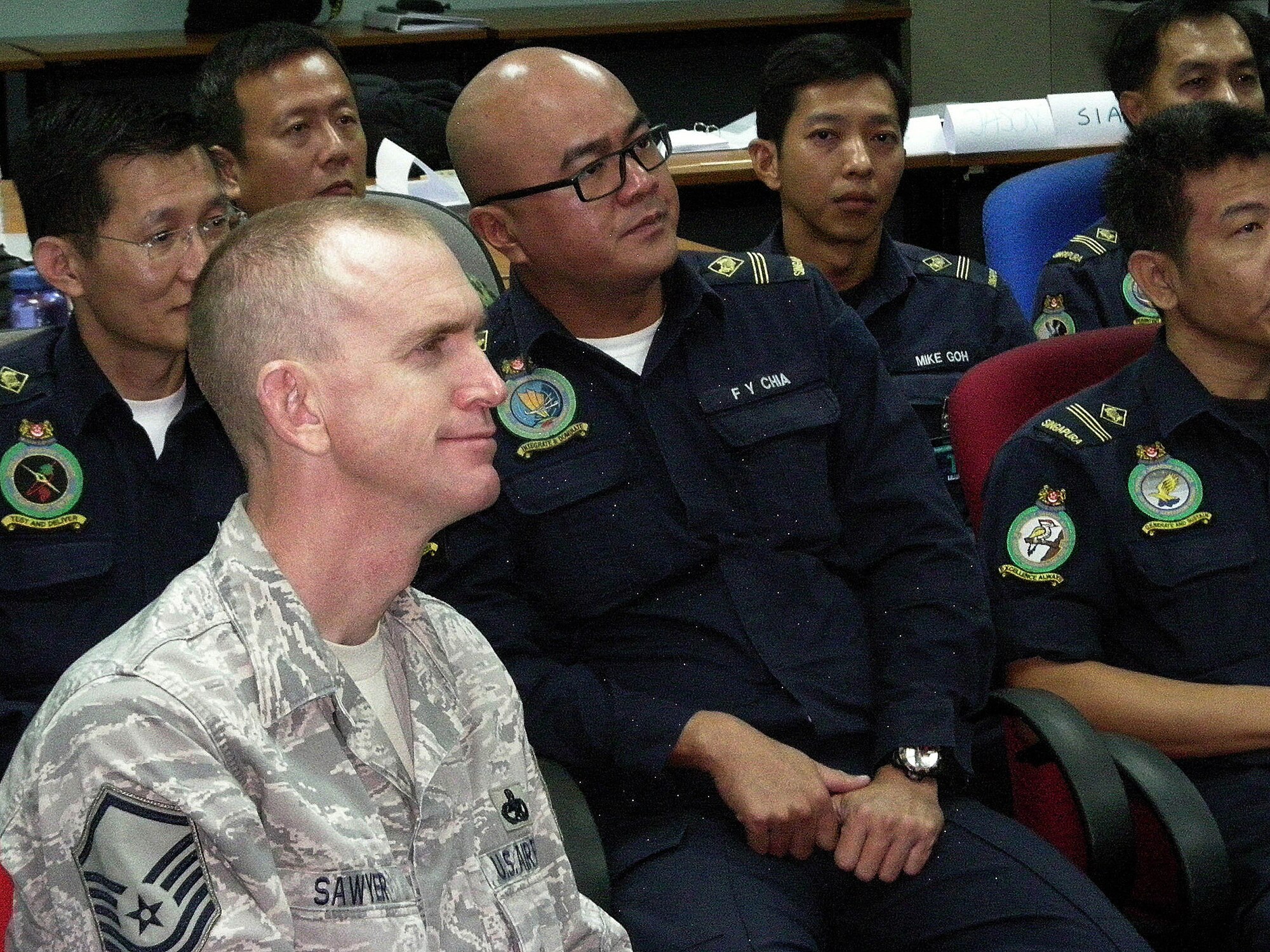 Master Sgt. David Sawyer attends the Advanced Leadership Program with
Singapore airmen Jan. 15, 2011, at Pasir Laba Camp, Republic of Singapore.
The program included 75 Singapore airmen and four international students and
focused on communication, leadership, management, and mentoring and
evaluation tactics. (Courtesy Photo)  
