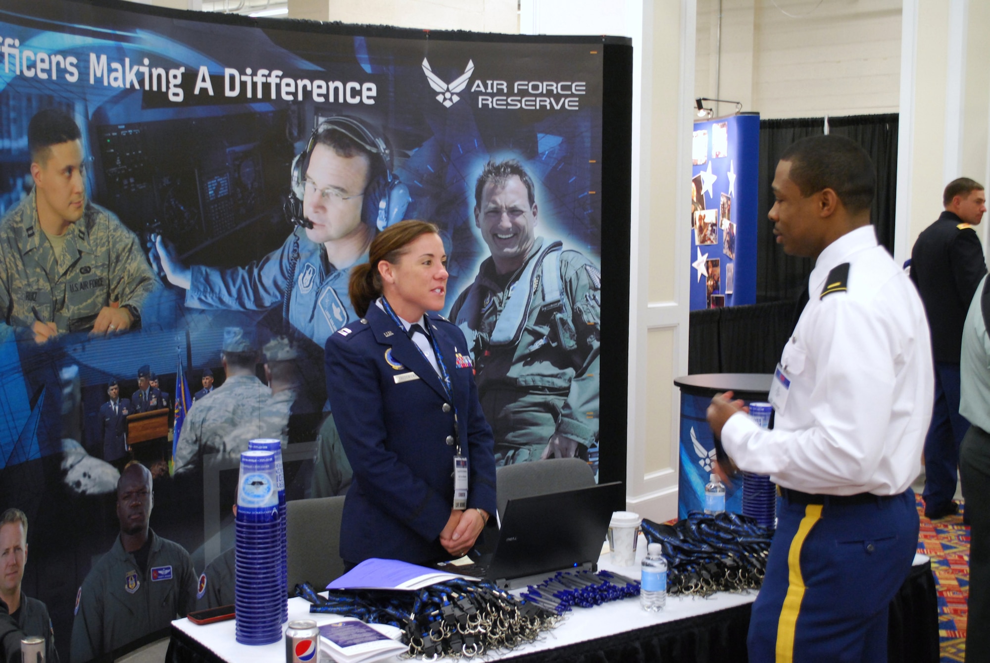 Capt. Holly Fredericks greets a potential recruit for the Air Force Reserve Jan. 31, 2011, during the Reserve Component Expo in Washington, D.C.  Captain Fredericks is the officer in charge of recruiting systems certification for Headquarters Air Force Reserve Command at Robins Air Force Base, Ga.  (U.S. Air Force photo/Col. Bob Thompson)