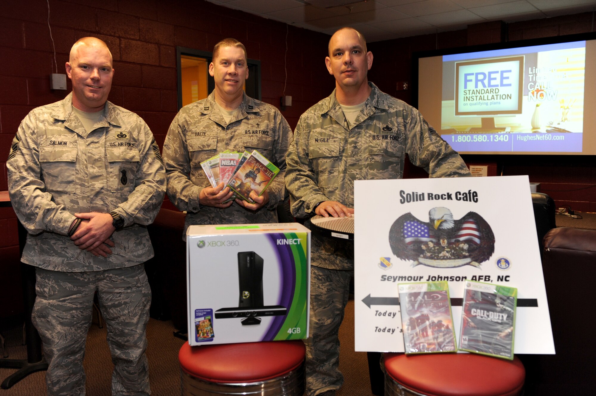 SEYMOUR JOHNSON AIR FORCE BASE, N.C. -- Representatives from the Top III and the Chiefs Group pose for a photo after donating an XBOX 360 and several games for the system to the solid Rock Café’ Feb. 3, 2011. The SRC, conveniently located in the same building as the Southern Eagle Dining Facility, is a place for Airmen to relax, socialize and enjoy free entertainment and internet access. (U.S. Air Force photo /Staff Sgt. Courtney Richardson)