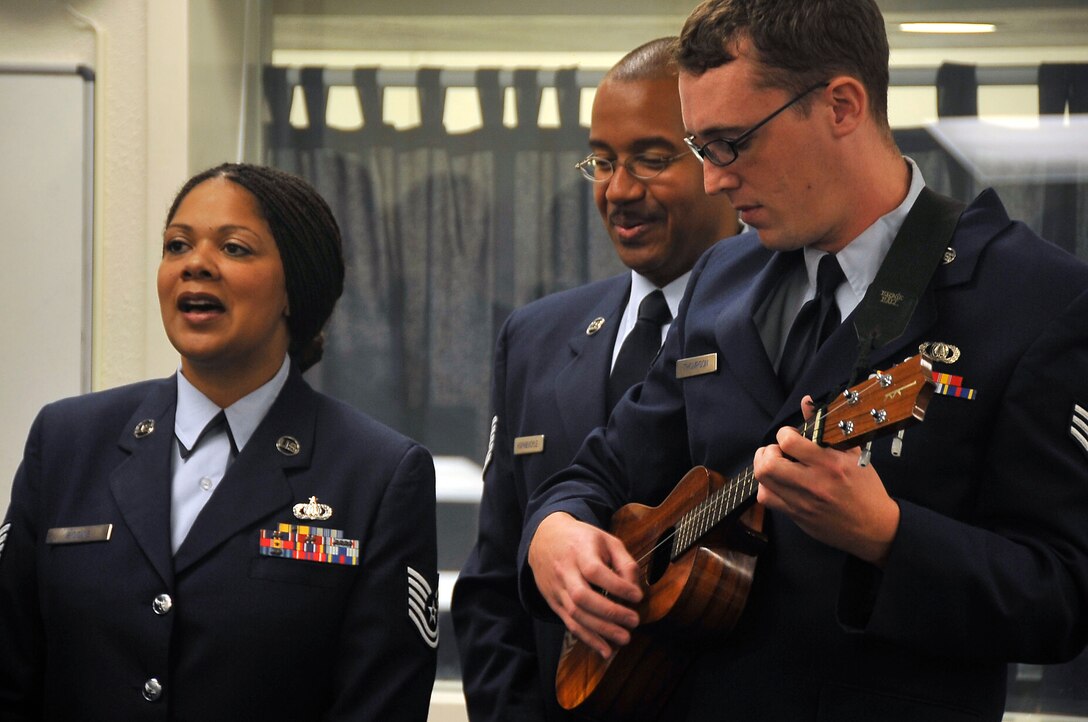 The USAF Band of the Pacific- Hawaii sing Aloha oe to MSgt Daryl Yager.  Shown are TSgt Tamiko Boone, TSgt Brian Hornbuckle, and SrA Jesse Thompson.