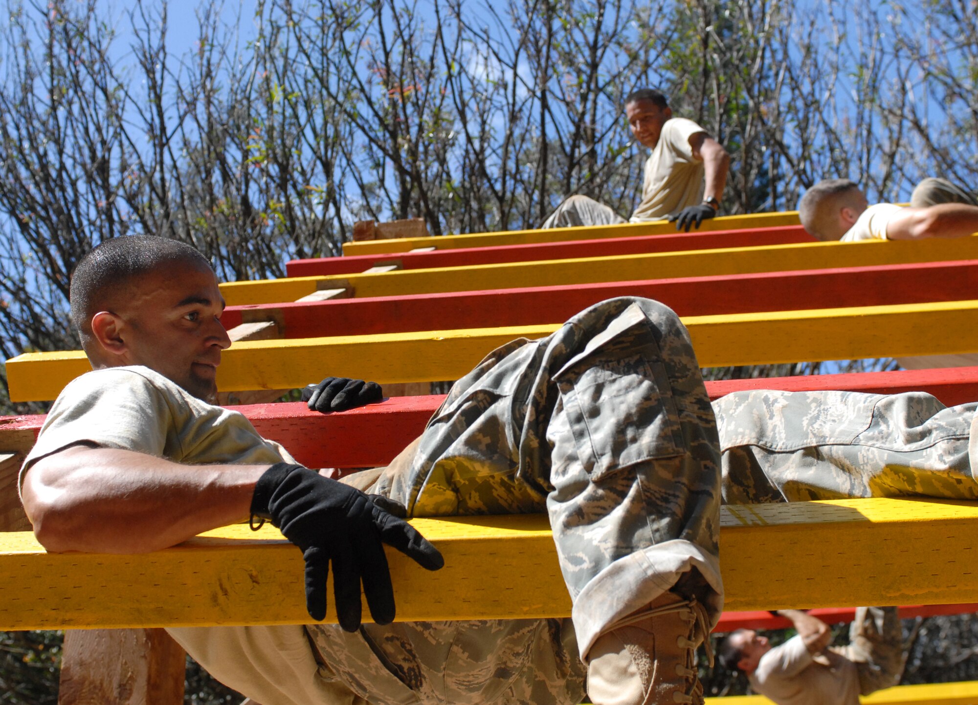 U.S. Air Force Tech. Sgt. Pablo Gonzalez, a 647th Security Forces Squadron Airman, completes the final obstacle in a course owned by Schofield Barracks during try-outs for the Army Air Assault Course Feb. 1, 2011, in Wahiawa, Hawaii. Sergeant Gonzalez and 15 other security forces members from Joint Base Pearl Harbor-Hickam, Hawaii, are scheduled to attend the two-week Air Assault Course beginning May 5, 2011. These try-outs will help the Air Force security forces NCO in charge of training determine which Airmen he will send to this challenging course. (U.S. Air Force photo/Staff Sgt. Carolyn Viss)
