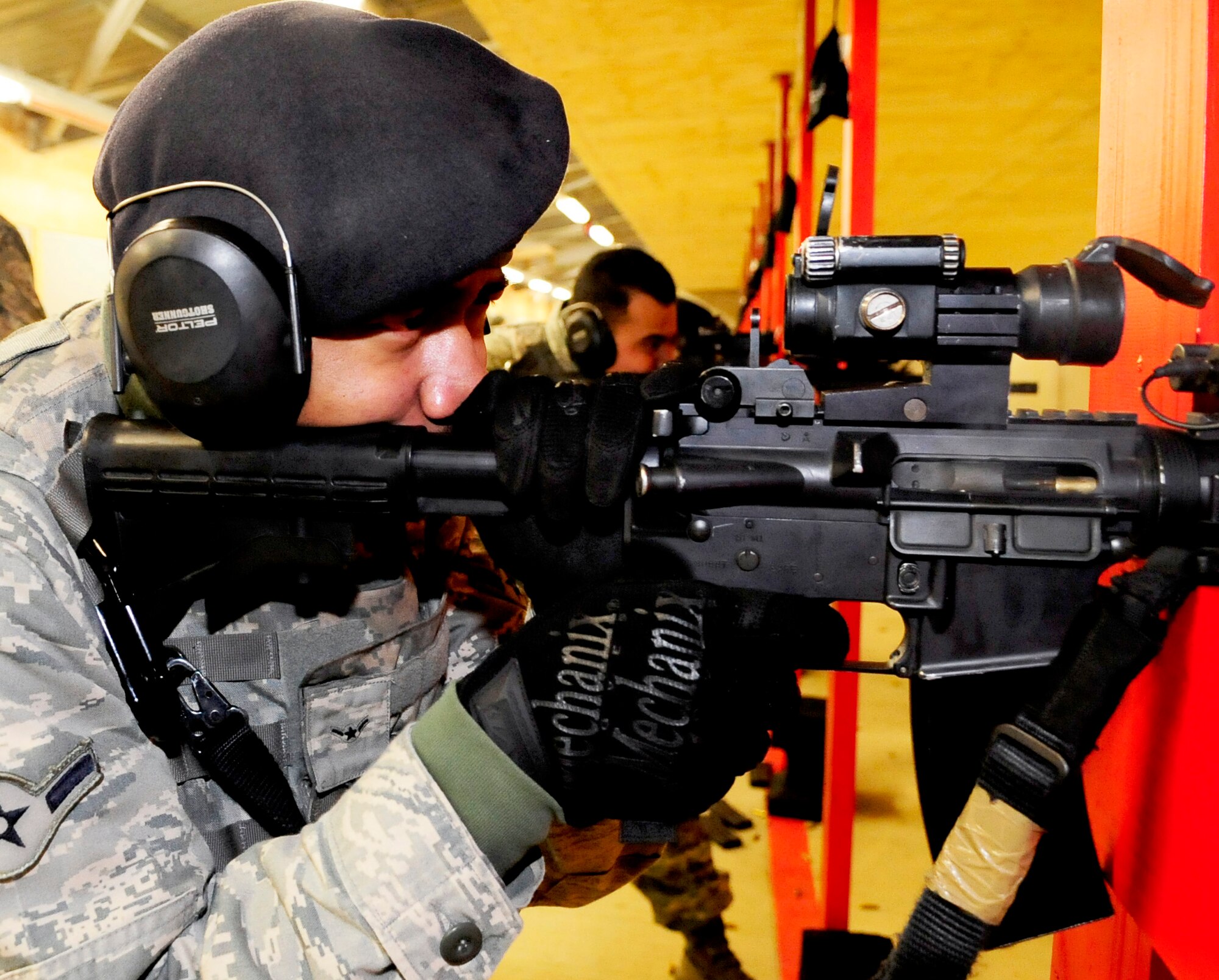 RAF FELTWELL, England -- Airman Nelson Williamson, 100th Security Forces Squadron security response patrolman, takes aim downrange while in the standing- supported position during a weapons qualification course for RAF Mildenhall security forces members here Feb. 3, 2011. To qualify, security forces members are required to score 18 shots out of 30 in three positions: prone-supported, keeling-supported and standing-supported. (U.S. Air Force photo/Senior Airman Ethan Morgan)