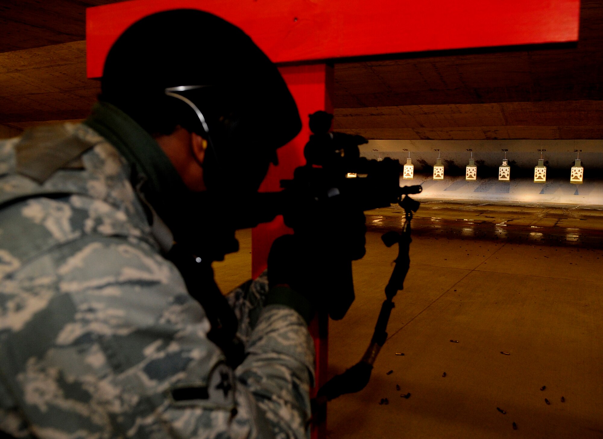 RAF FELTWELL, England -- Airman Nelson Williamson, 100th Security Forces Squadron security response patrolman, qualifies on an M-4 carbine during a weapons qualification course for RAF Mildenhall security forces members here Feb. 3, 2011. If any member should fail to qualify, they would be required to return to the firing range for remedial training and one-on-one instruction. (U.S. Air Force photo/Senior Airman Ethan Morgan)