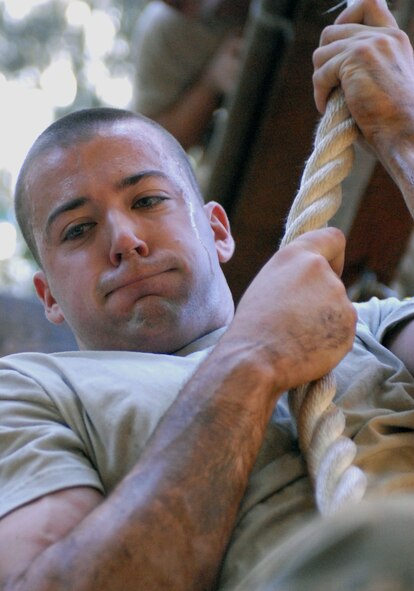 Senior Airman Jeffrey Kristek, a 647th Security Forces Squadron Airmen from Joint Base Pearl Harbor-Hickam, Hawaii, climbs a rope on "The Tough One," an obstacle on a course owned by Schofield Barracks, Feb. 1, 2011, in Wahiawa, Hawaii. A total of 16 security forces members are scheduled to attend a two-week Army Air Assault Course beginning May 5, 2011. The February try-outs will help the Air Force security forces NCO in charge of training determine which Airmen he will send to this challenging course. (U.S. Air Force photo/Staff Sgt. Carolyn Viss)